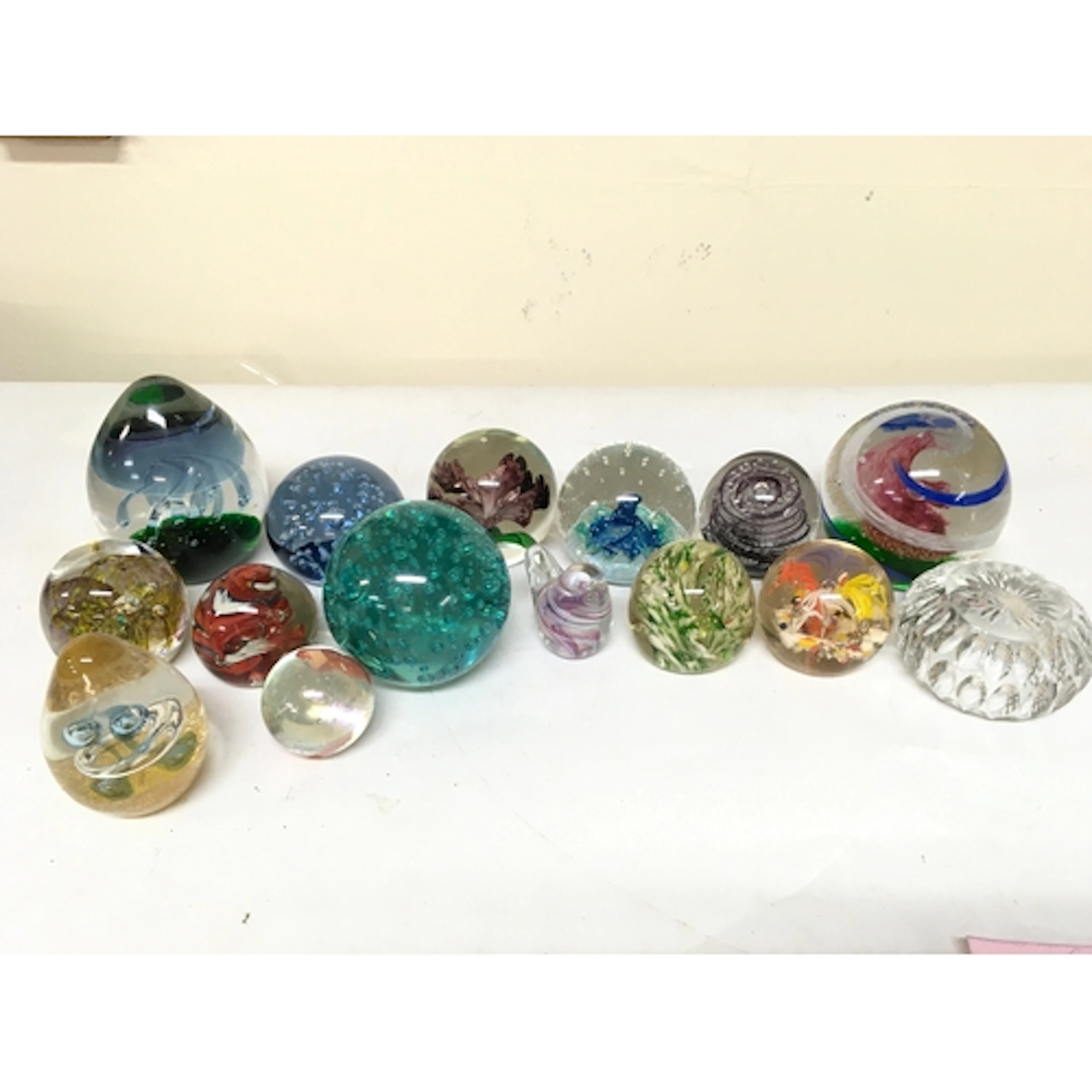 A quantity of paperweights