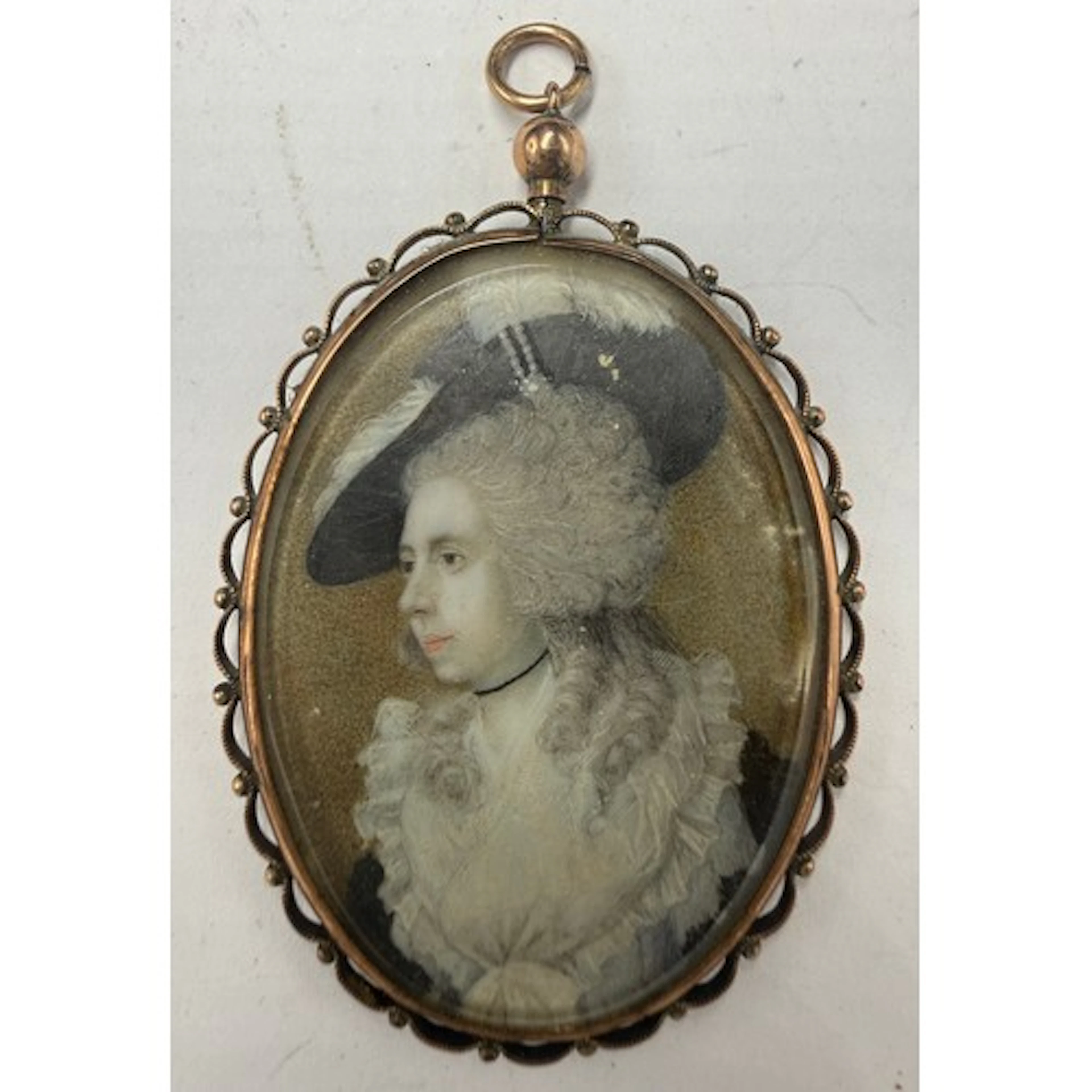A miniature painting of a lady wearing a black plumed hat on...