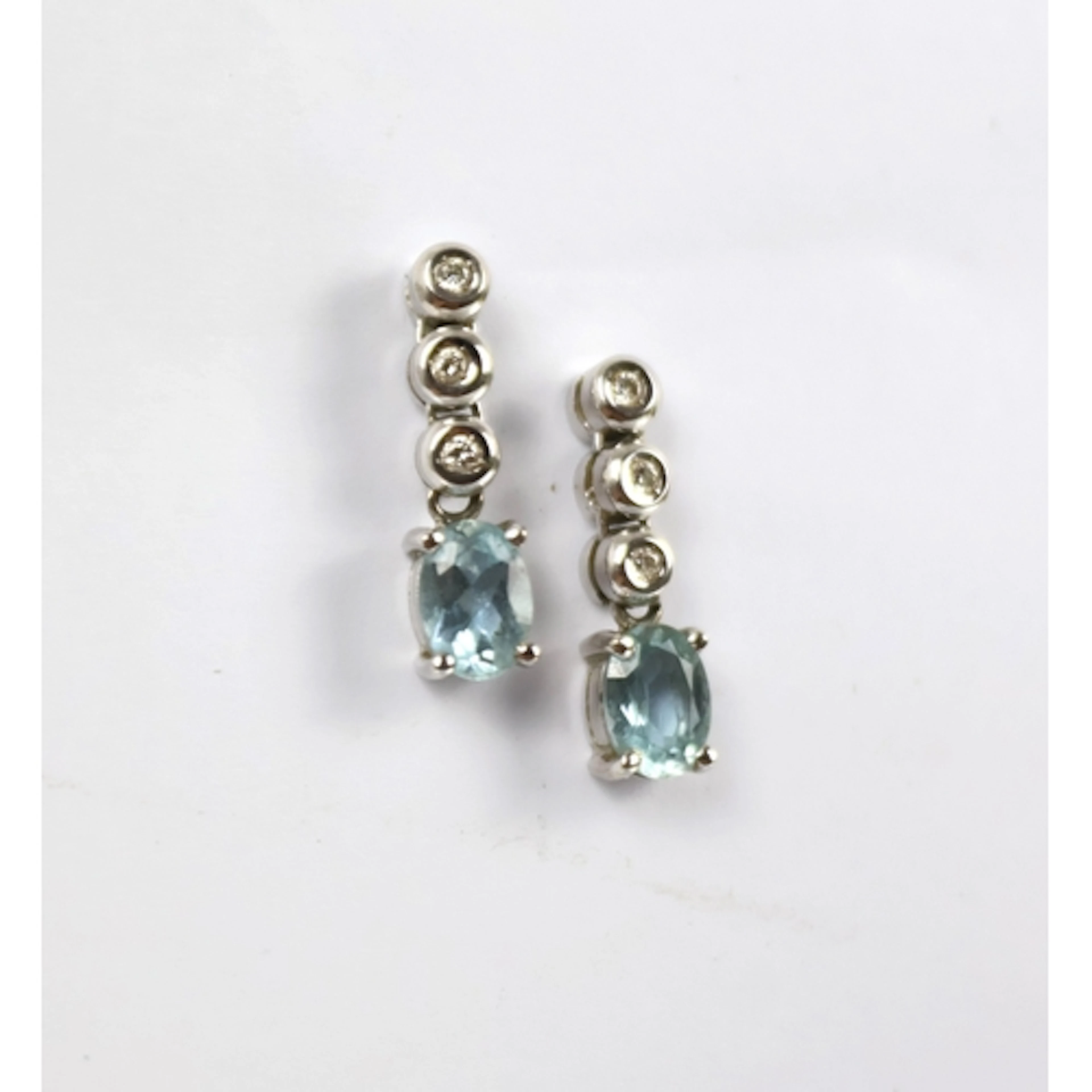 A pair of aquamarine and diamond set drop earrings, designed...