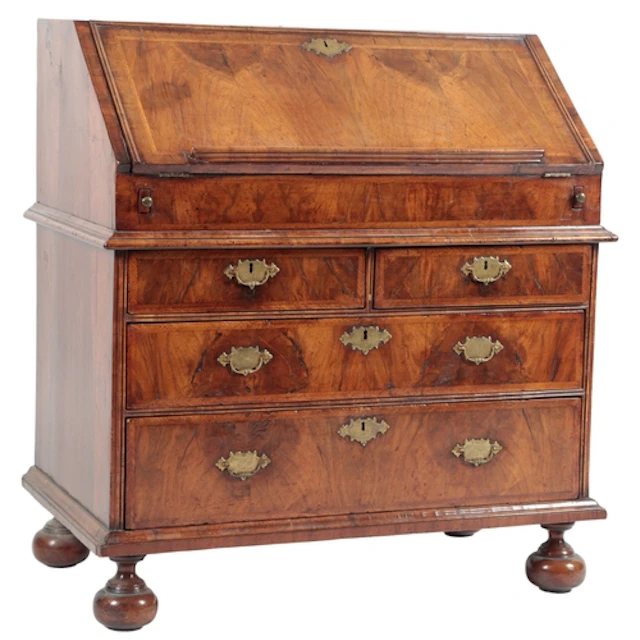 A Queen Anne feather banded walnut bureau, the fall front wi...