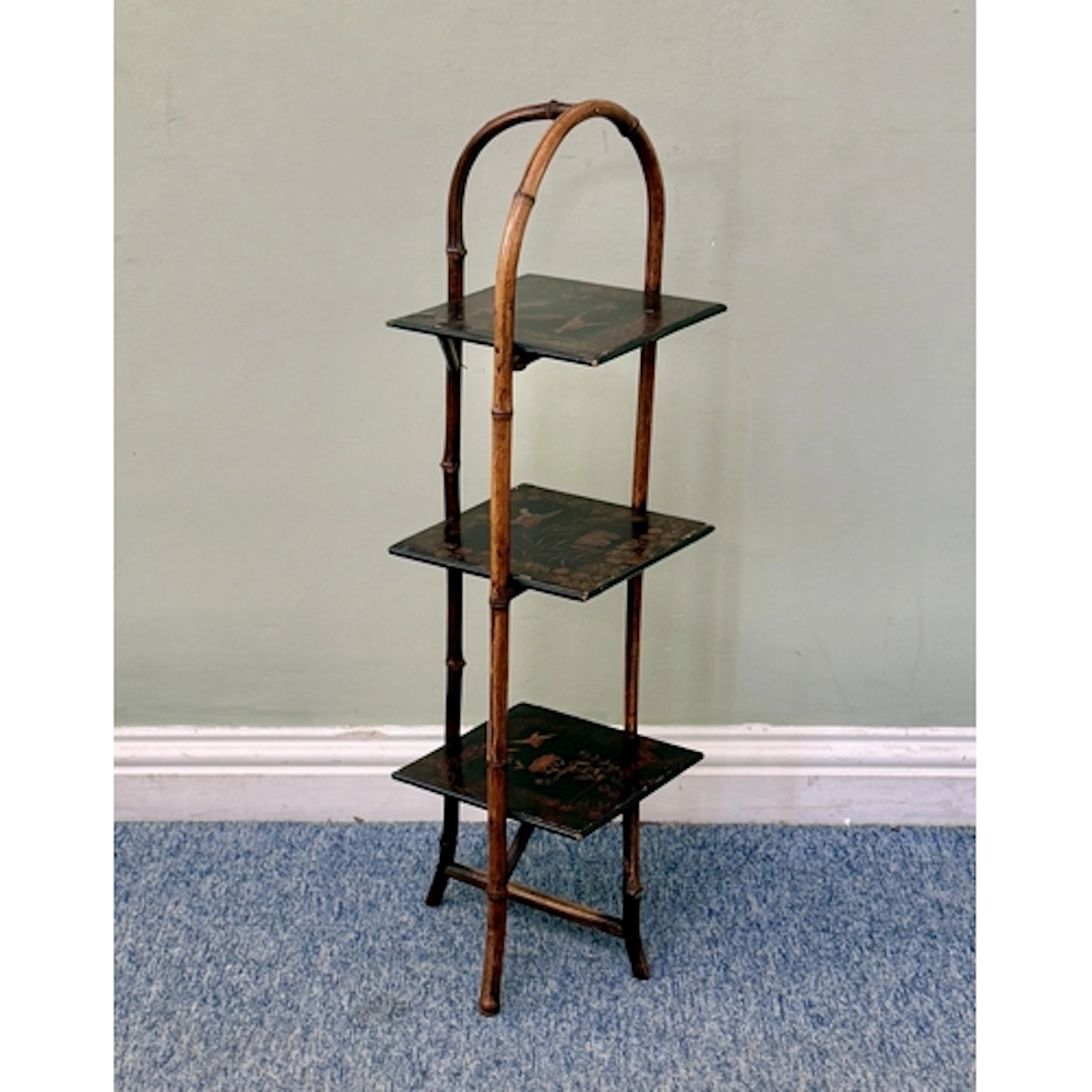 A Victorian bamboo and chinoiserie lacquered three tier cake...