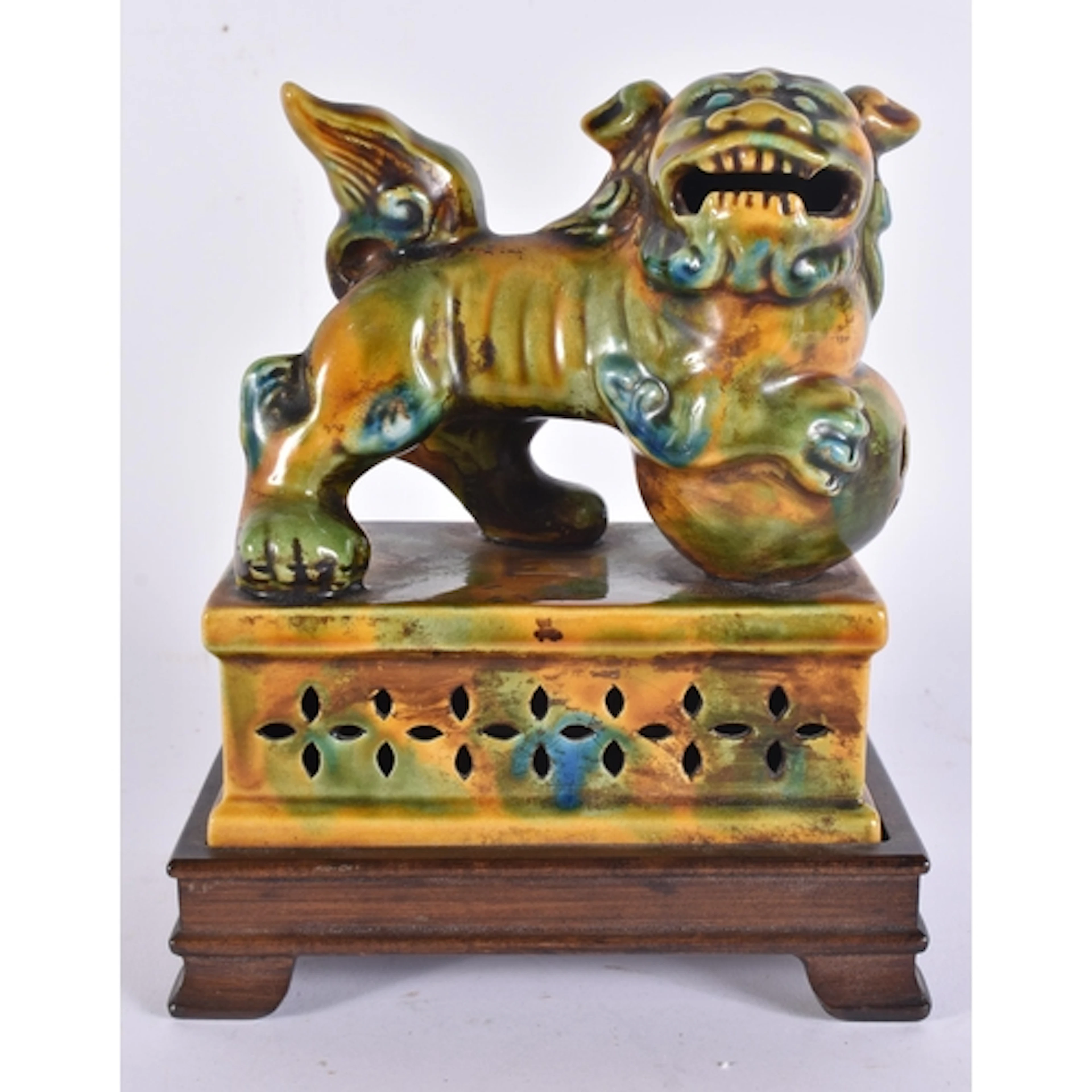 A CHINESE SANCAI GLAZED POTTERY FIGURE. 21 cm x 13 cm.