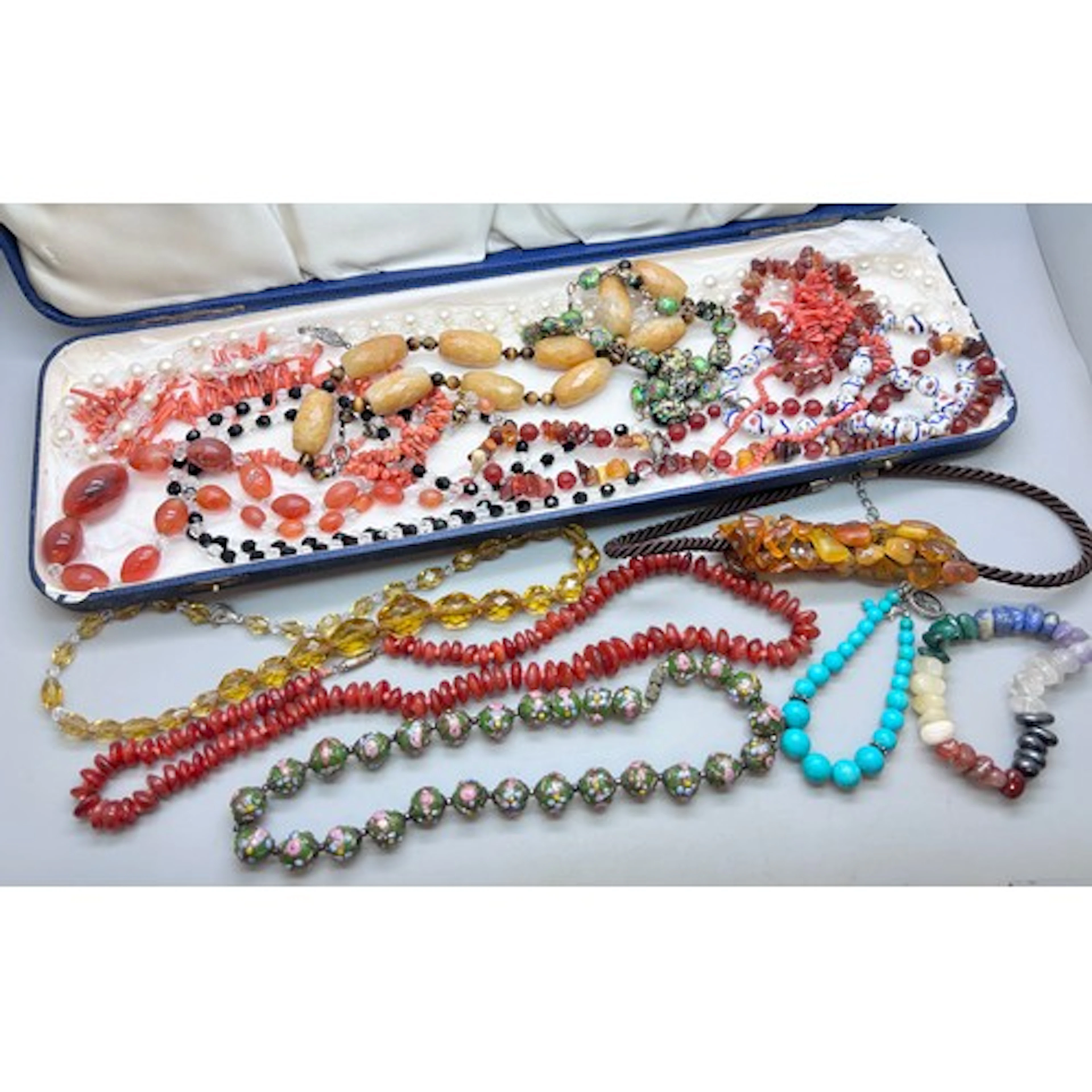 A collection of necklaces and bracelets including vintage fo...