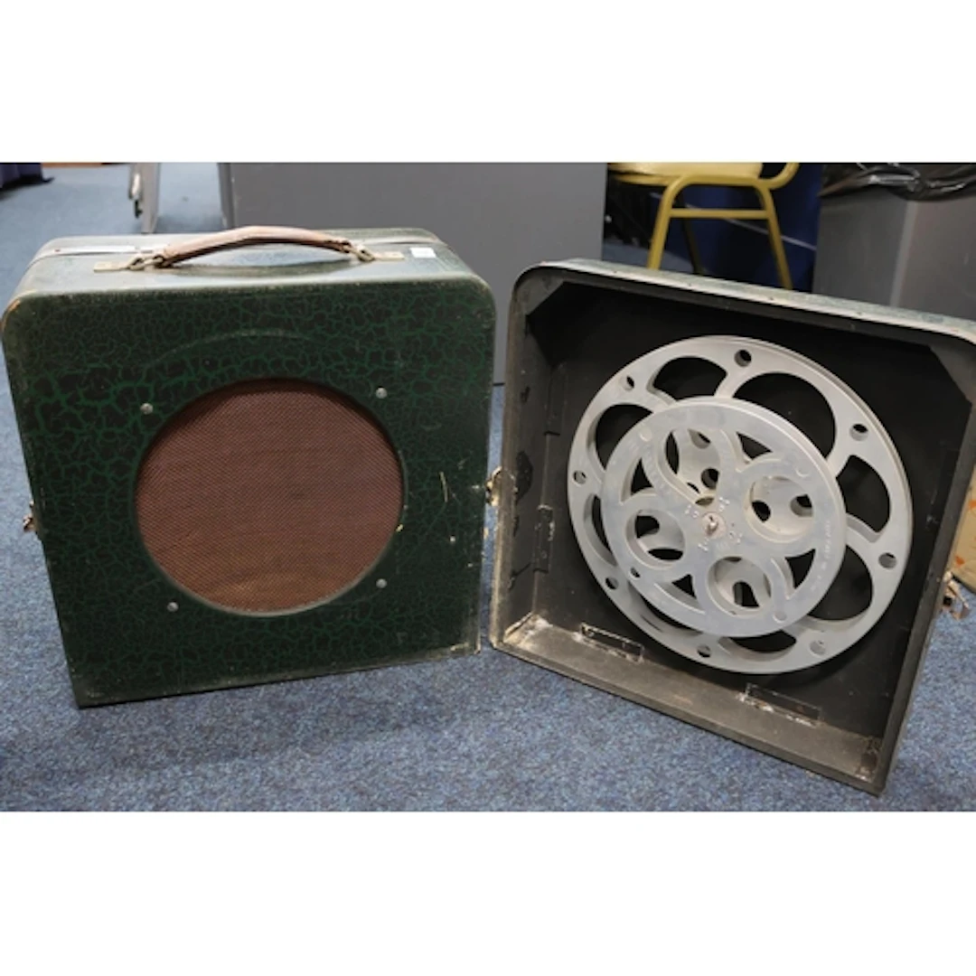 Projector reels and cased speaker.