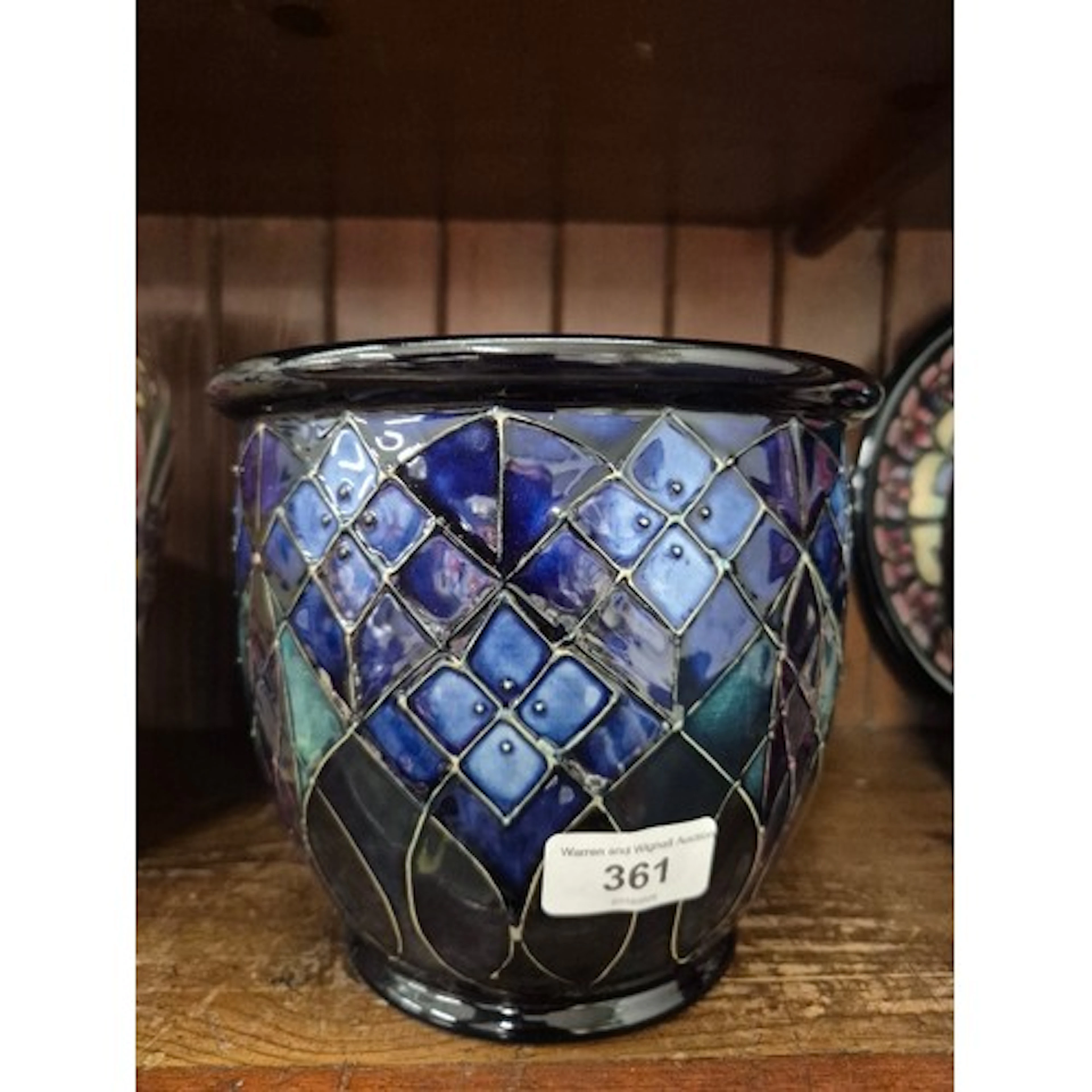 A Moorcroft jardiniere/planter lattice pattern with blue and...