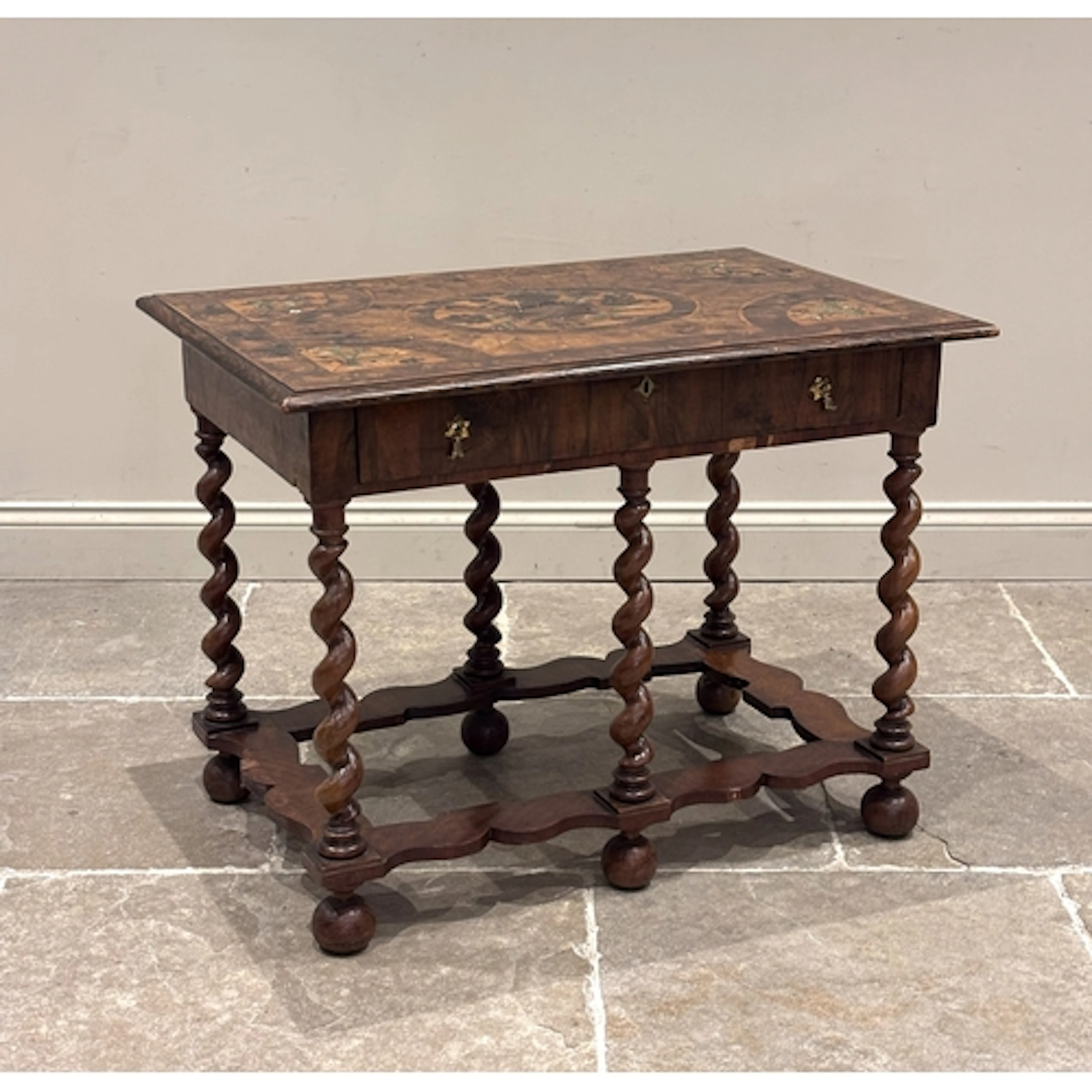 A Charles II olivewood, yew, and walnut oyster veneered ivor...