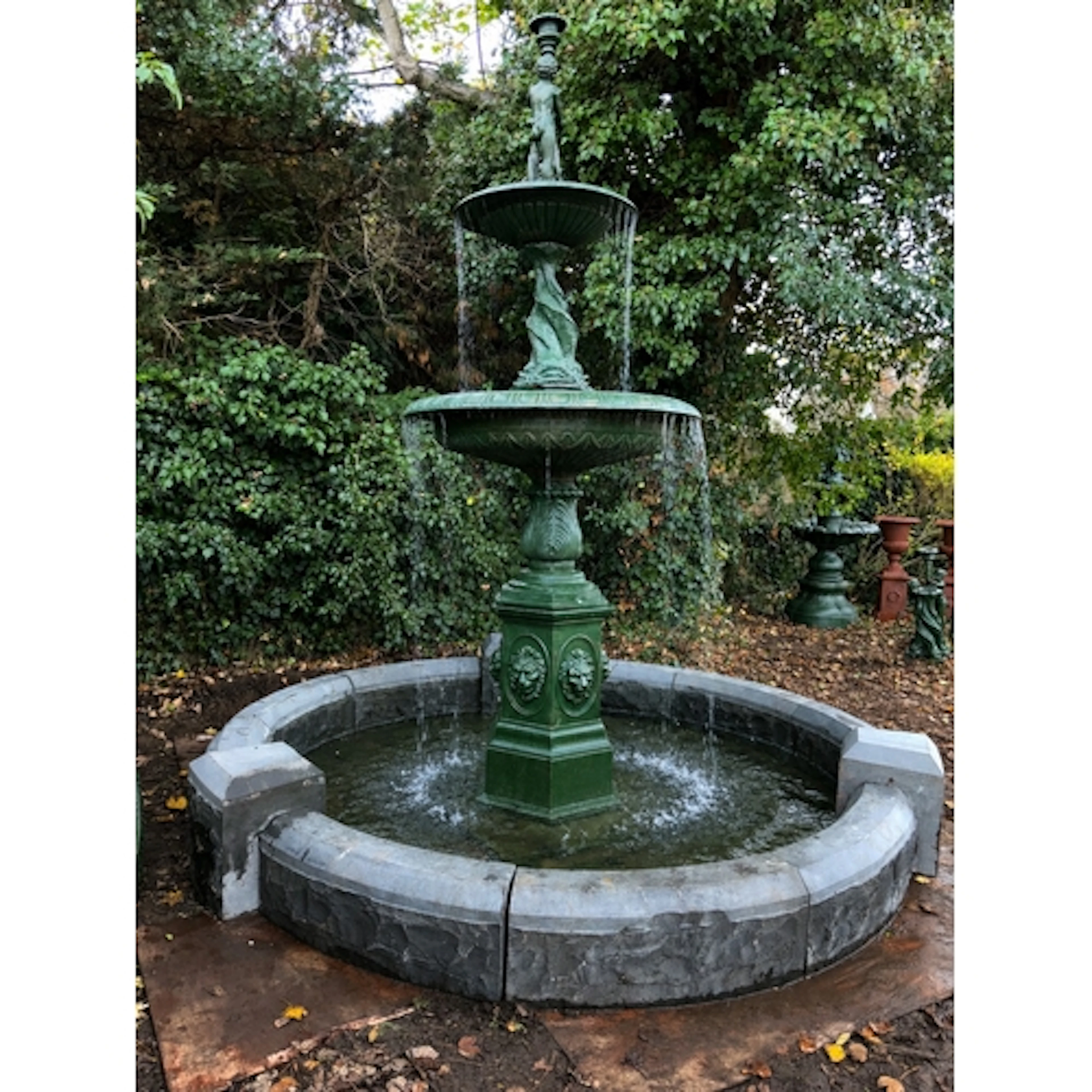 A monumental Georgian style classical two-tier cast iron gar...