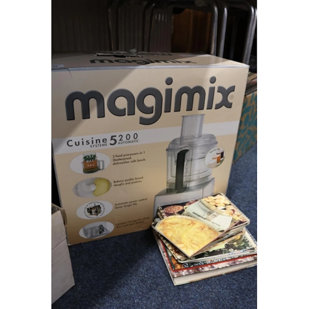 Magimix Cuisine 5200 food processor and recipe books.