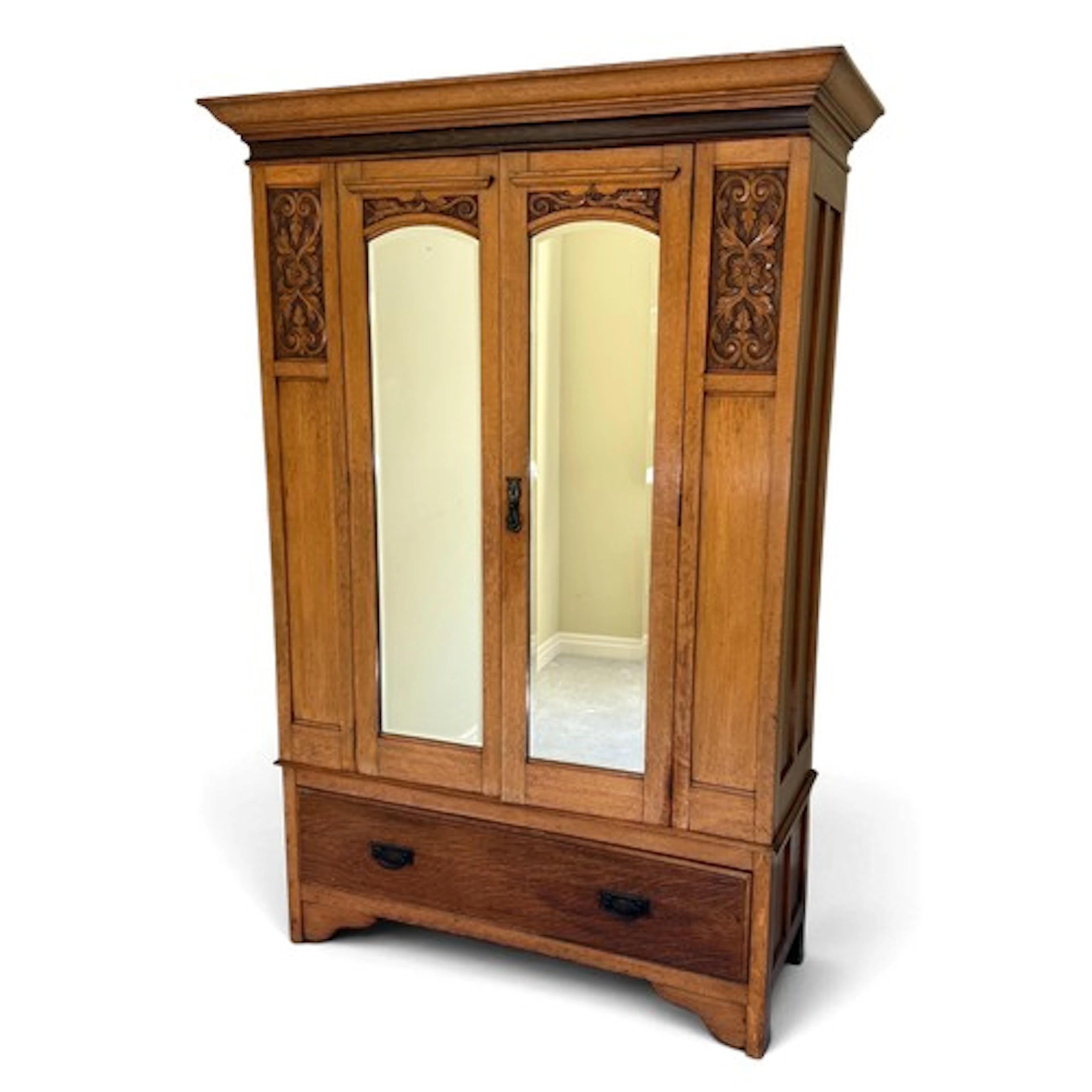 An Edwardian double wardrobe with lower drawer and Art Nouve...