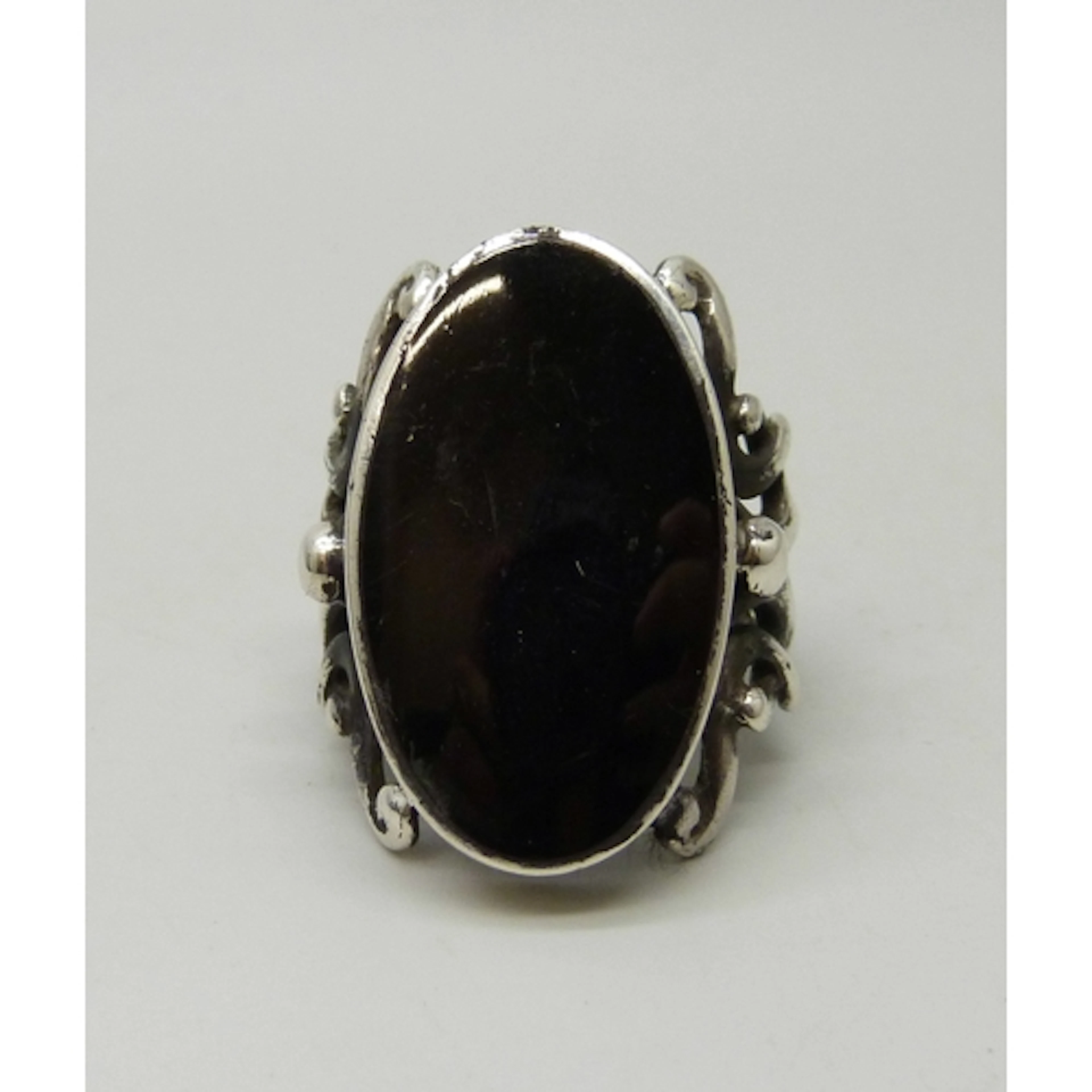 A statement silver ring set with onyx, 2.7cm stone, S
