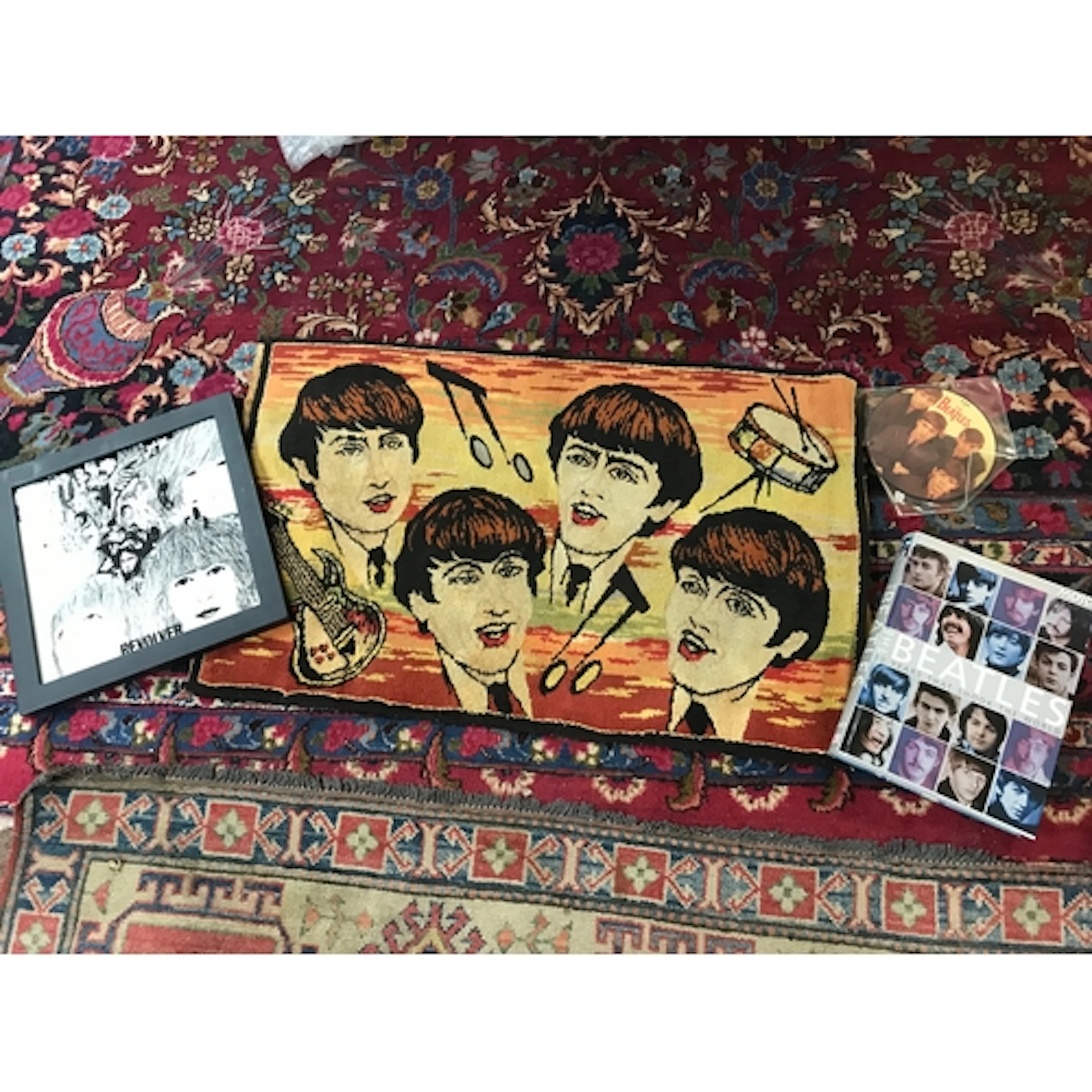 A collection of Beatles memorabilia including a Beatles...