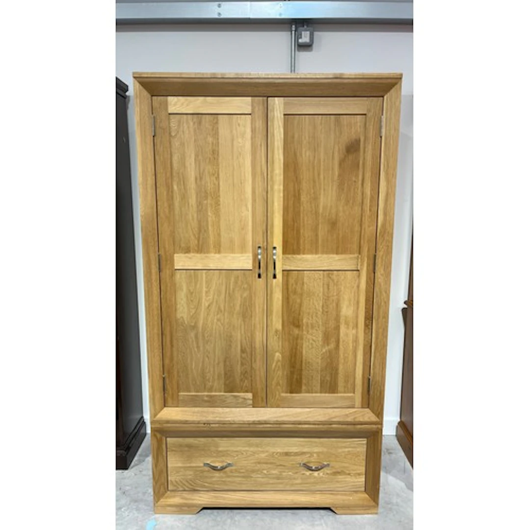 Contemporary oak two door wardrobe including hanging space o...