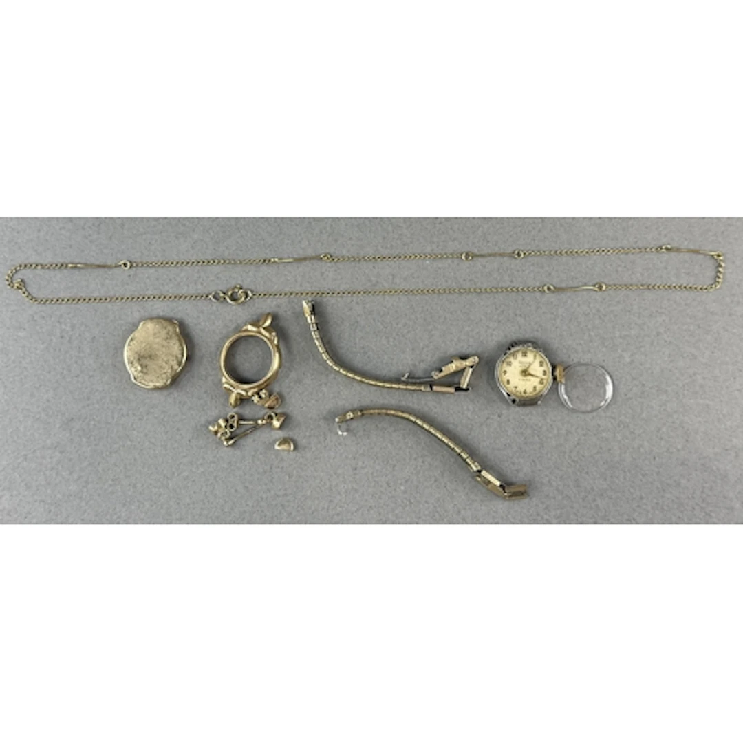 Jewellery: a 9ct gold ladies watch case, a necklace and earr...