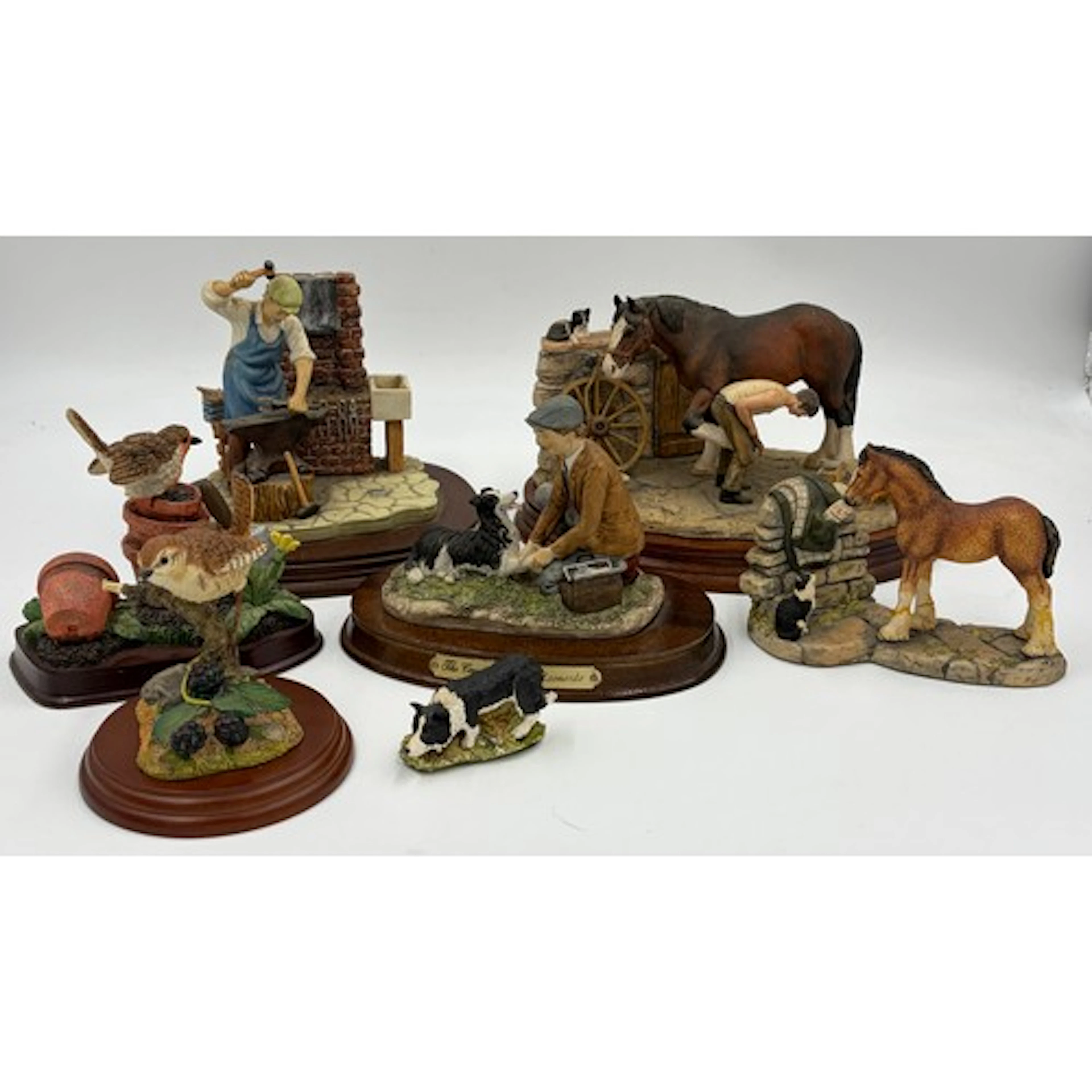 A collection of Leonardo and Border Fine Arts country figure...