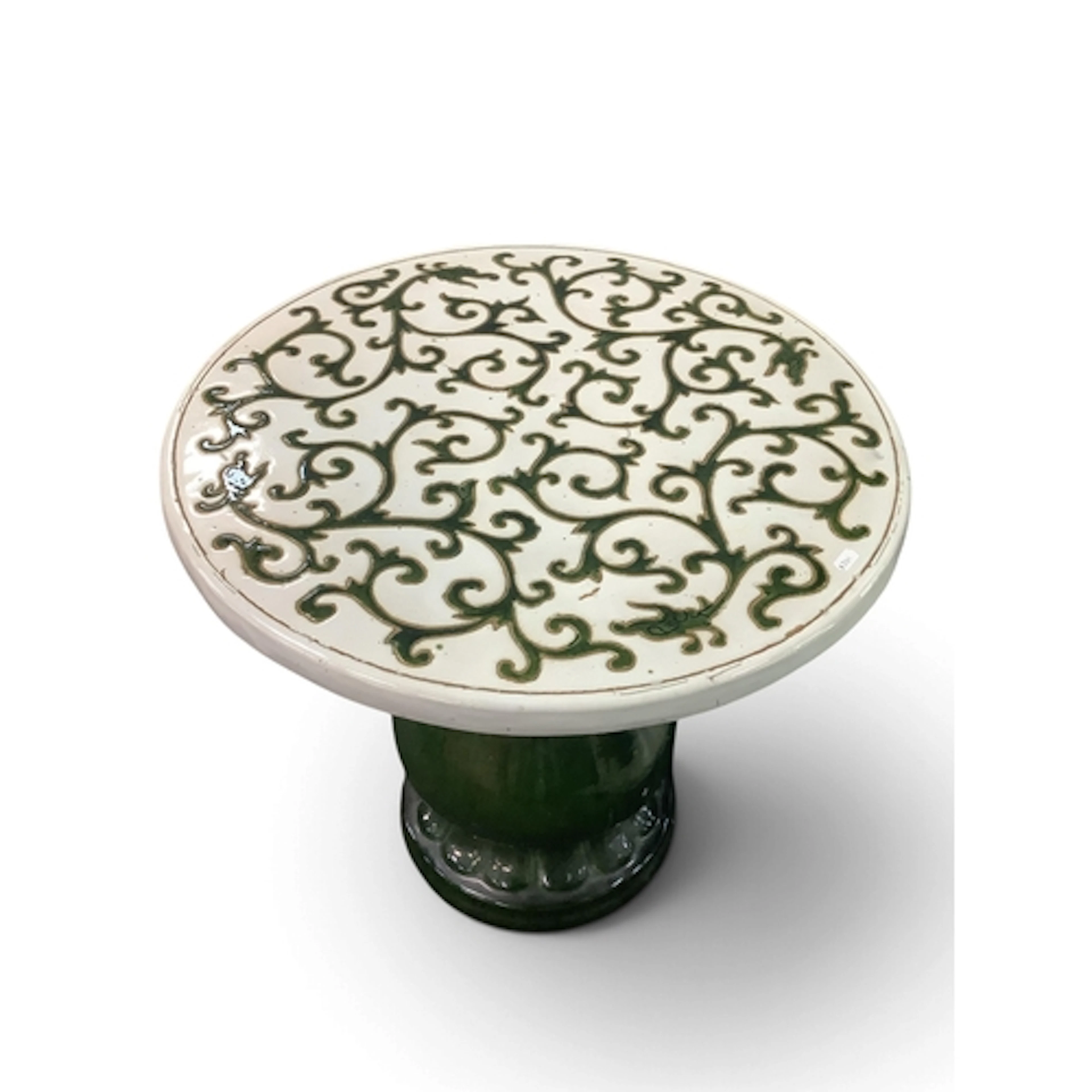 An Oriental-style glazed ceramic garden table, the circular ...