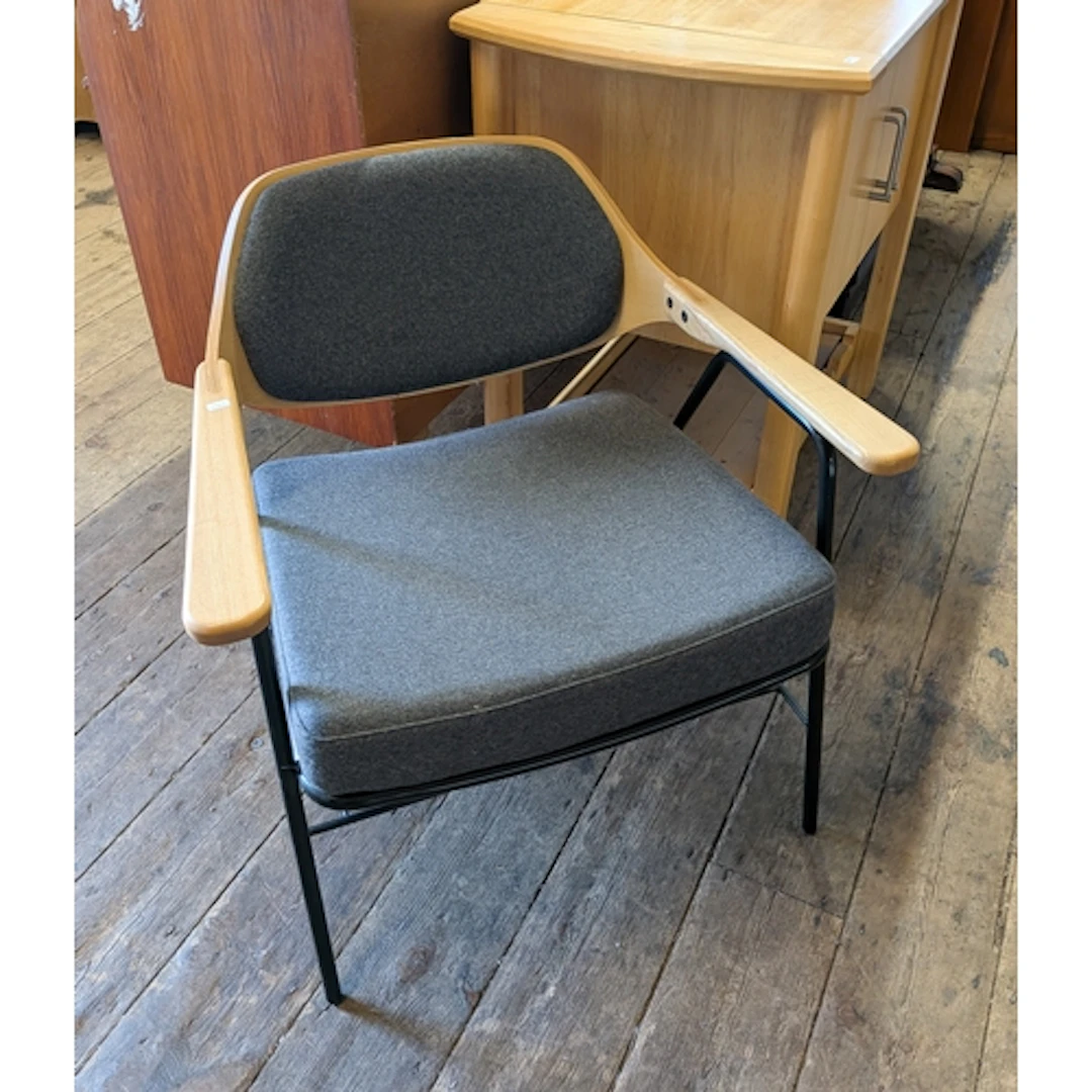 A light wood elbow chair with grey upholstered seat and back