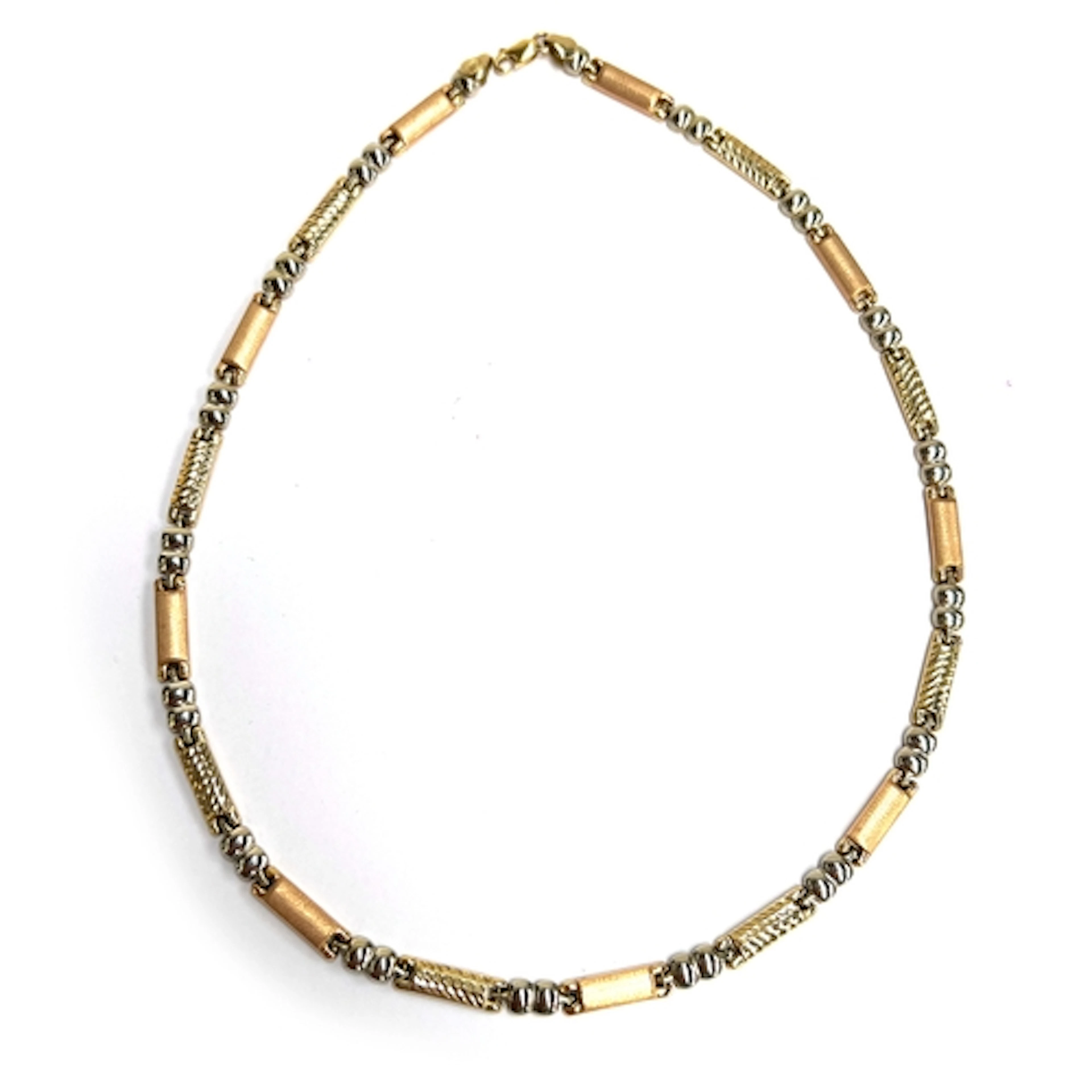 A 14ct three coloured gold necklace, the yellow gold links w...