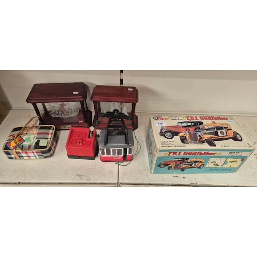 A Taiyo FBI Godfather toy car in original box, a Lehmann cab...