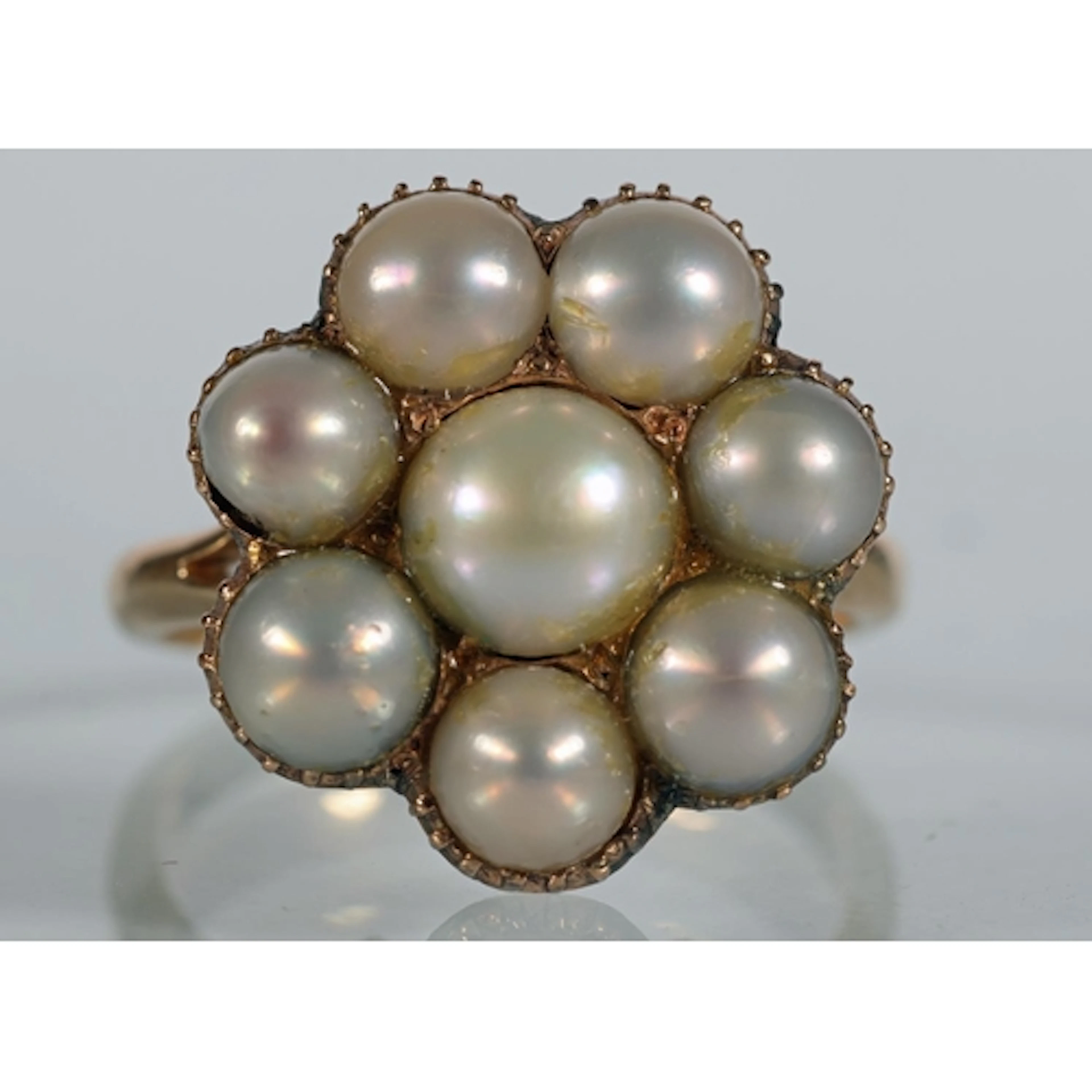 Unmarked gold tone ring set with pearls in the form of a flo...