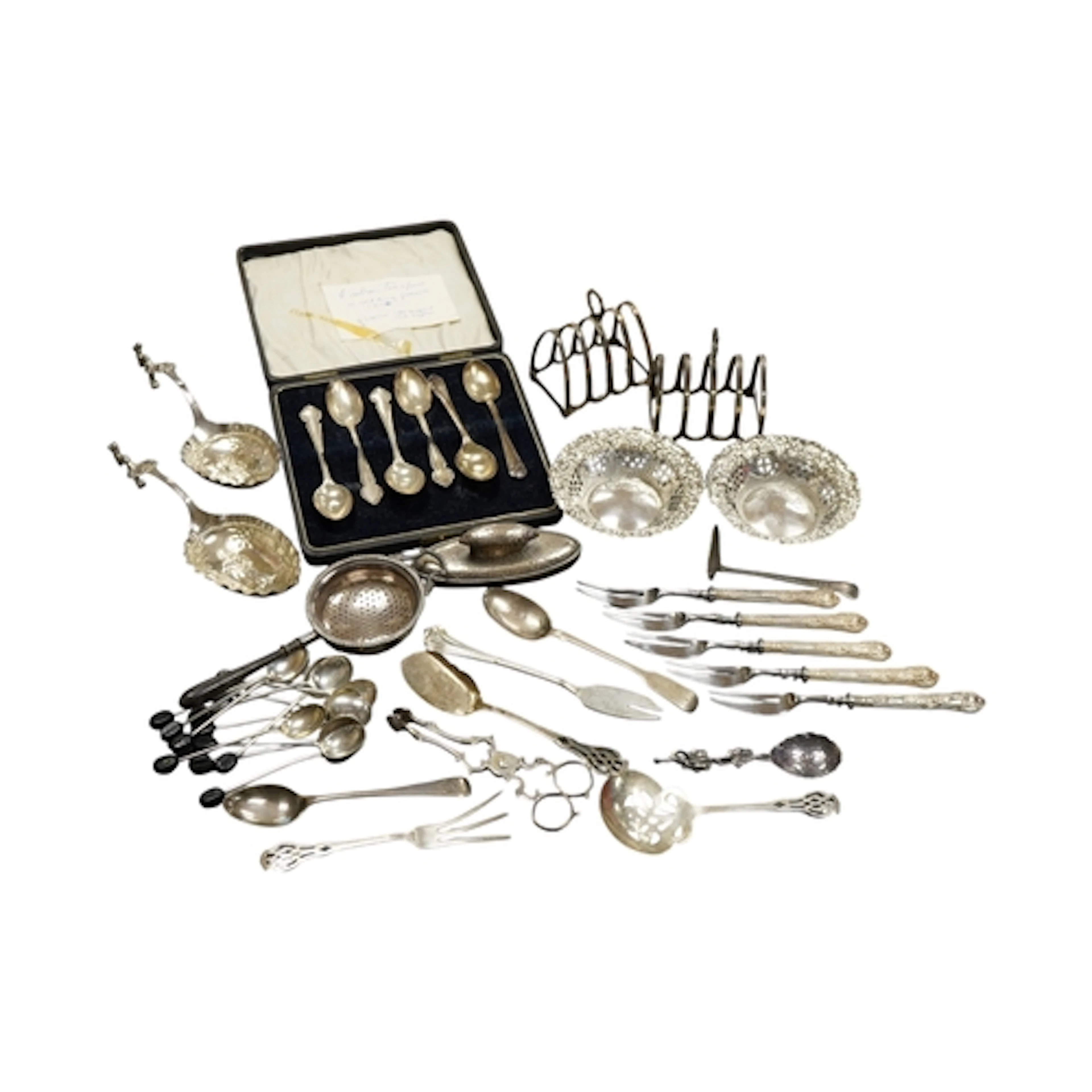A collection of assorted silver flatware including teaspoons...
