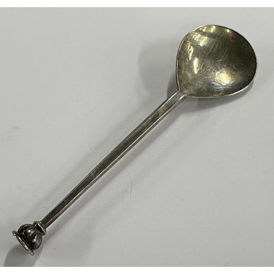 A silver spoon, marked to reverse. By Guild of Handicraft. A...