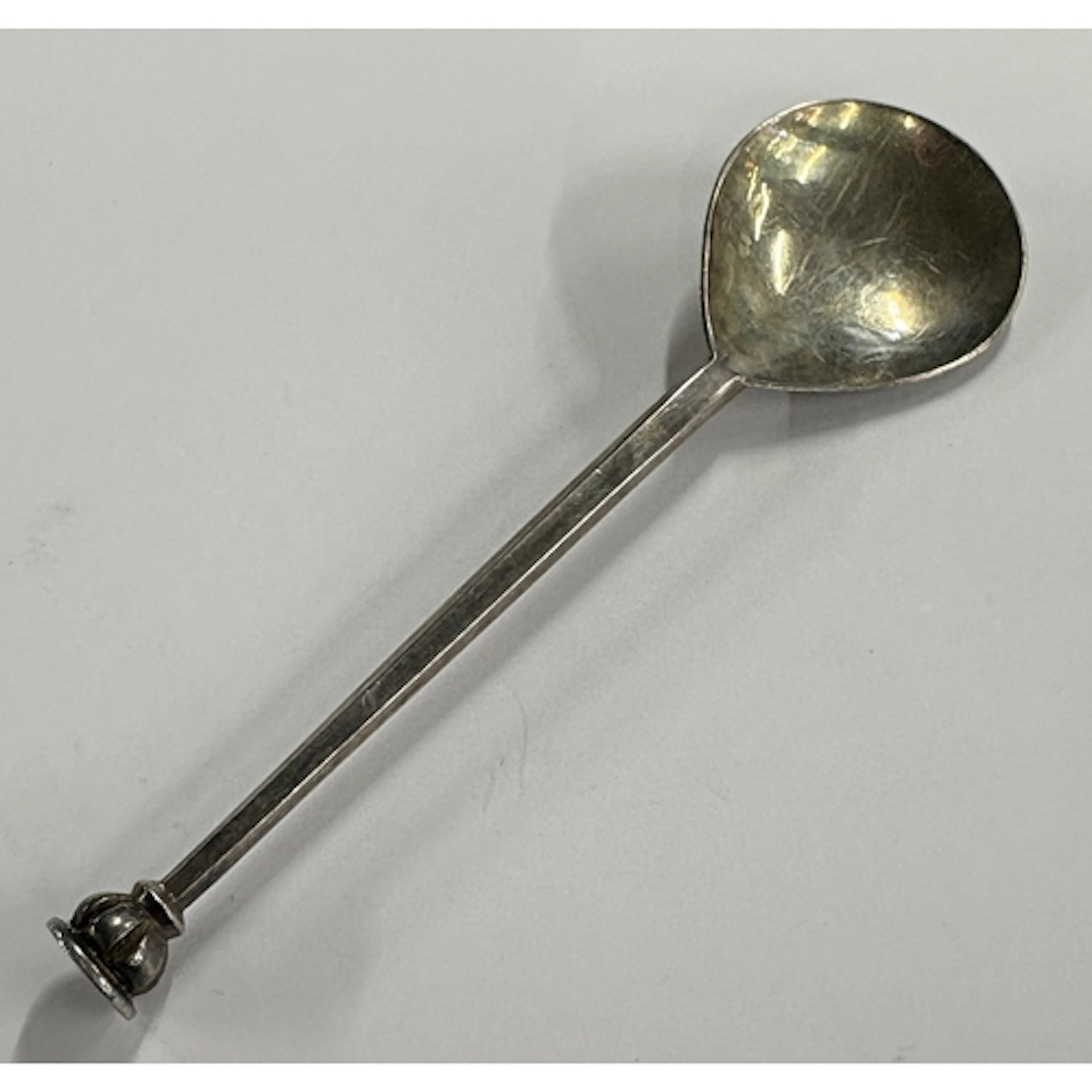 A silver spoon, marked to reverse. By Guild of Handicraft. A...