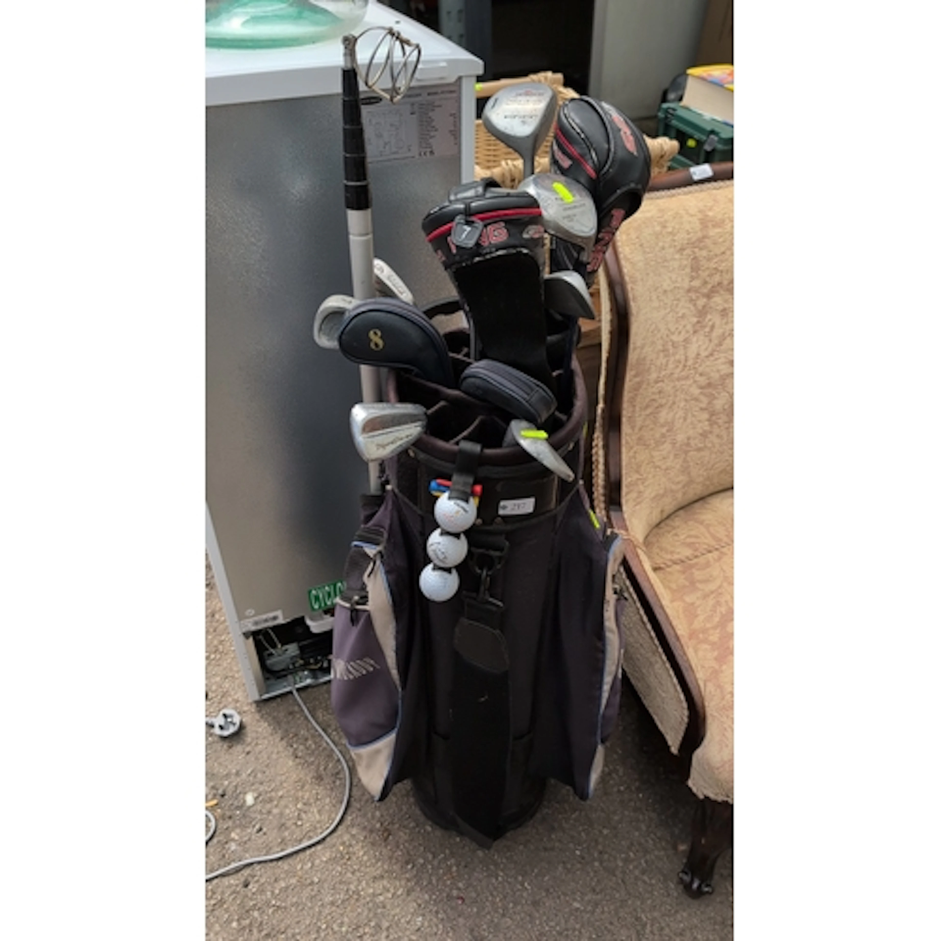 A quantity of golf clubs with headcovers, including Howson T...