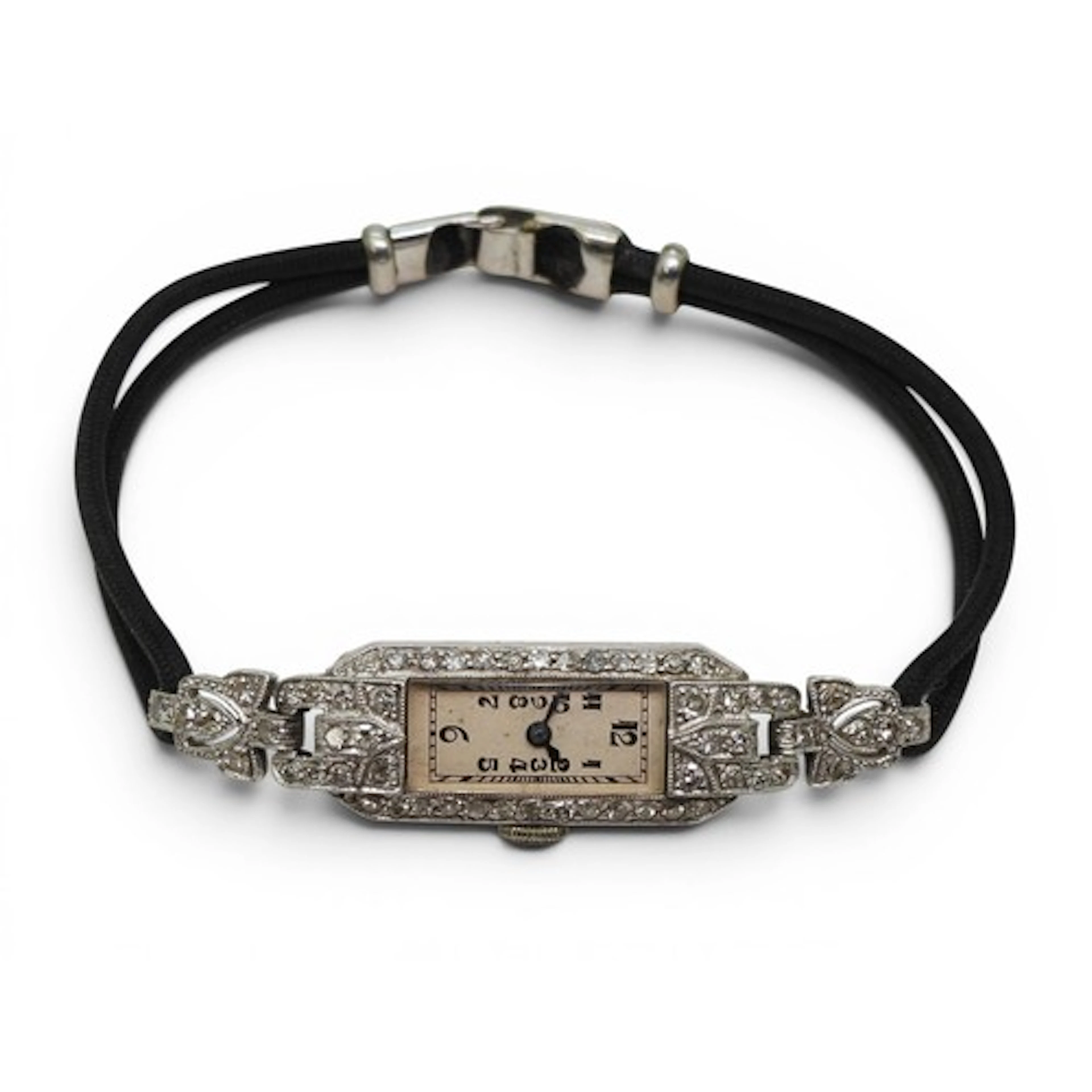A DIAMOND COCKTAIL WATCH made in platinum and set with eight...