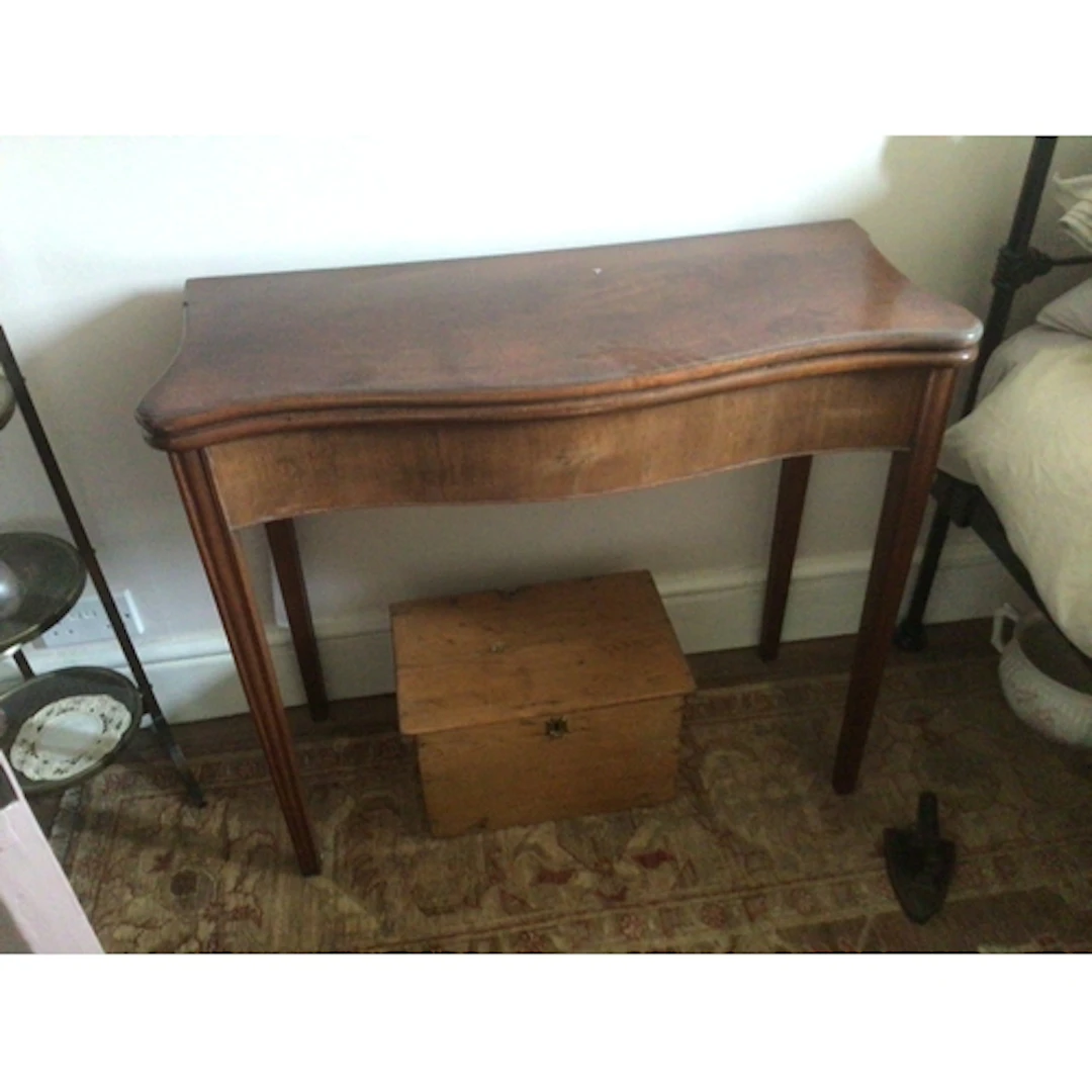 A late George III mahogany tea table serpentine fronted. On ...