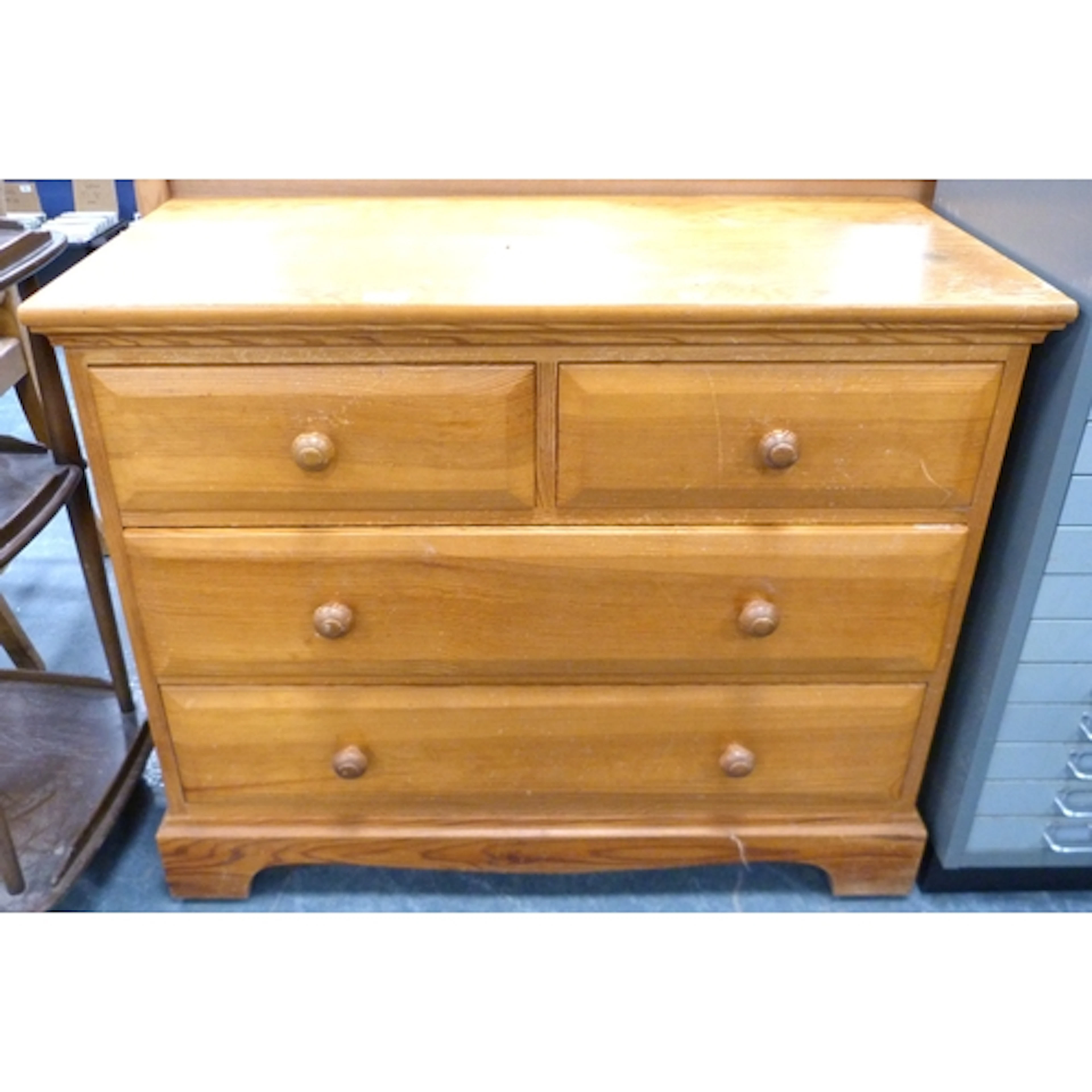 Pine chest of two short and two long drawers. 91cm wide.