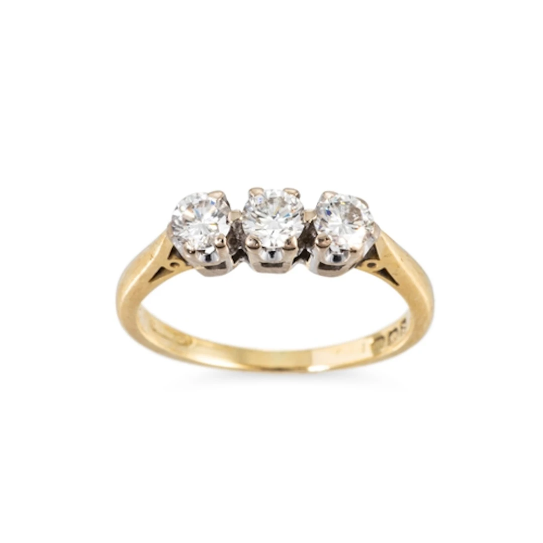 A THREE STONE DIAMOND RING, the round brilliant cut diamonds...