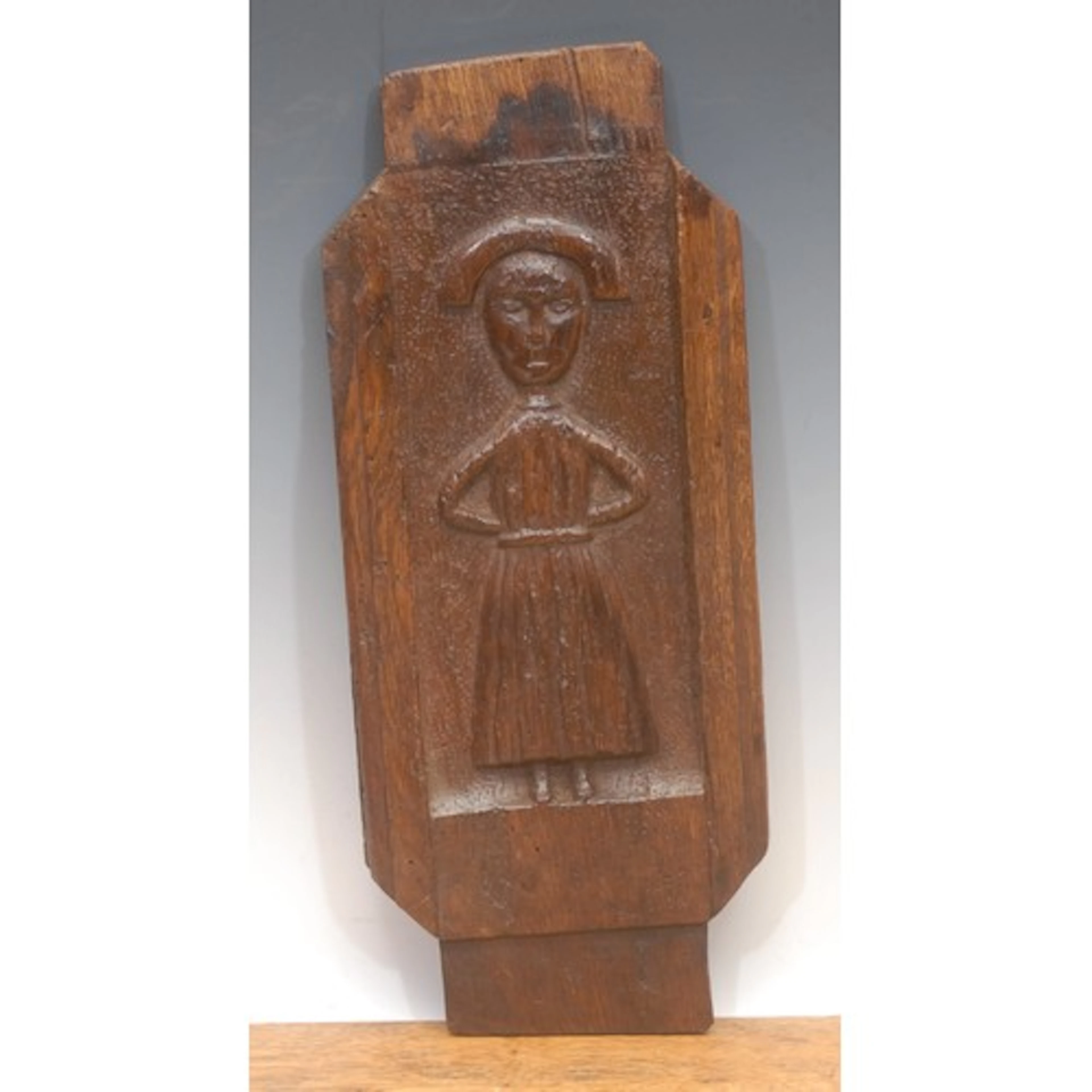 Treen - a 17th century provincial oak plaque, the central we...