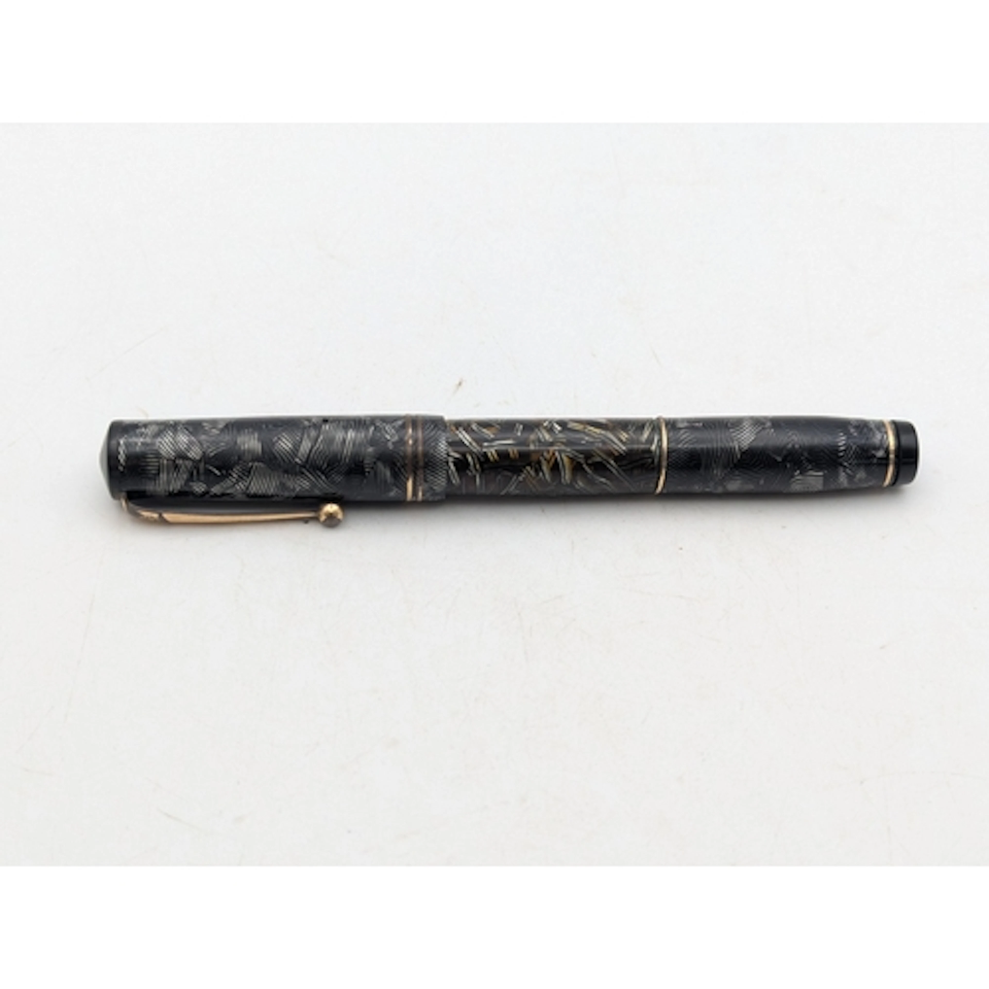 A vintage Mabie Todd Swan Visofil fountain pen, having a bla...