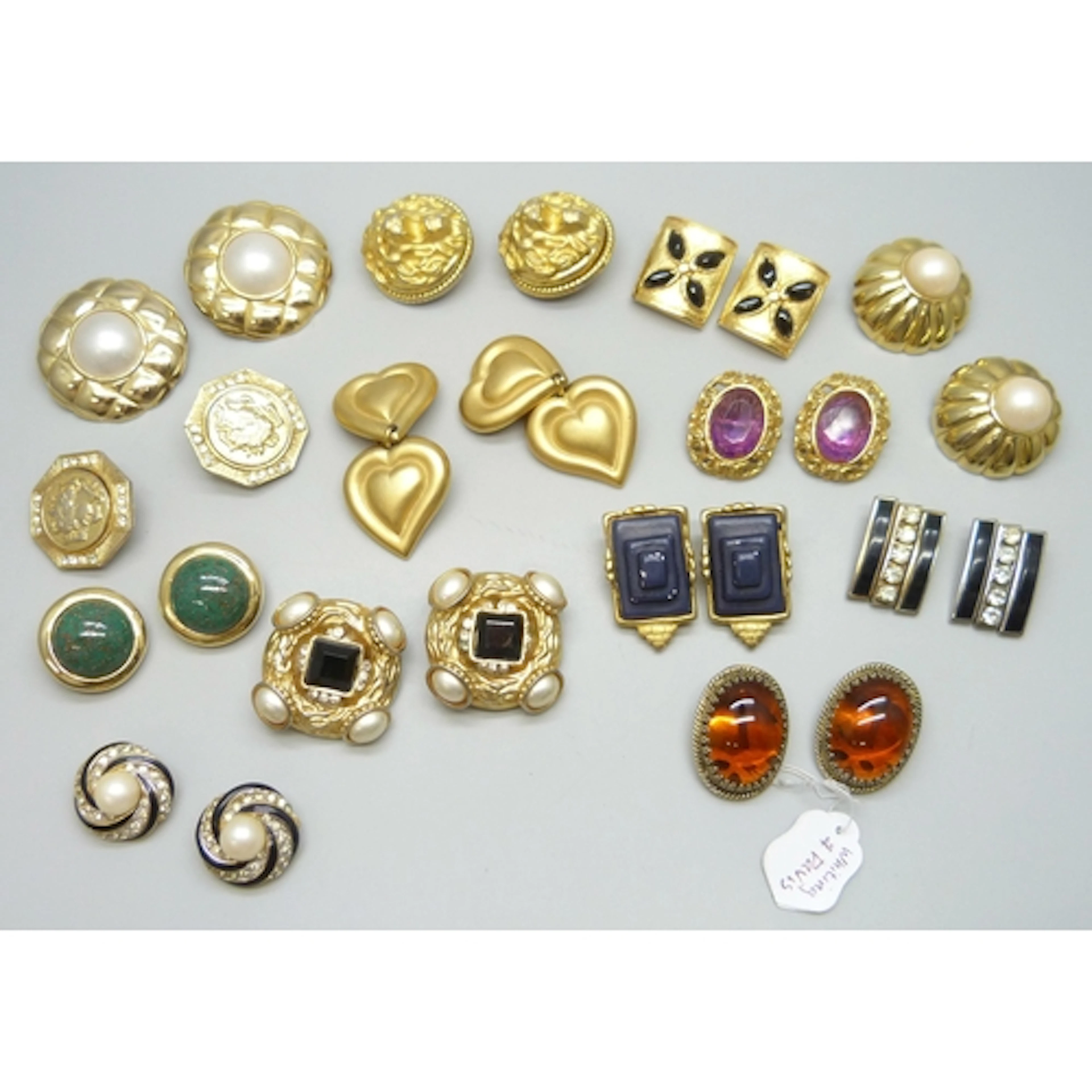 A collection of costume earrings including Nina Ricci