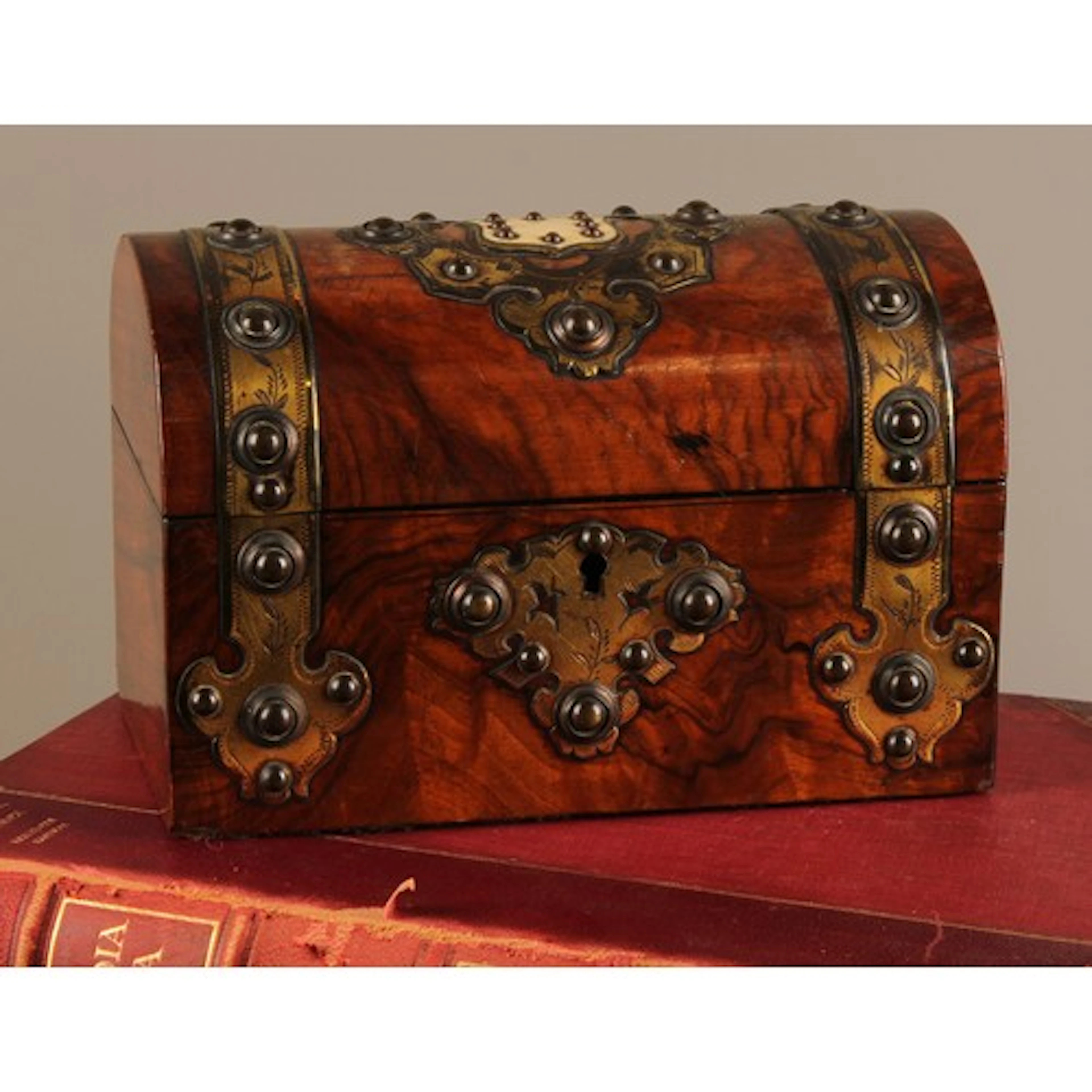 A Victorian burr walnut domed rectangular tea caddy, the cov...
