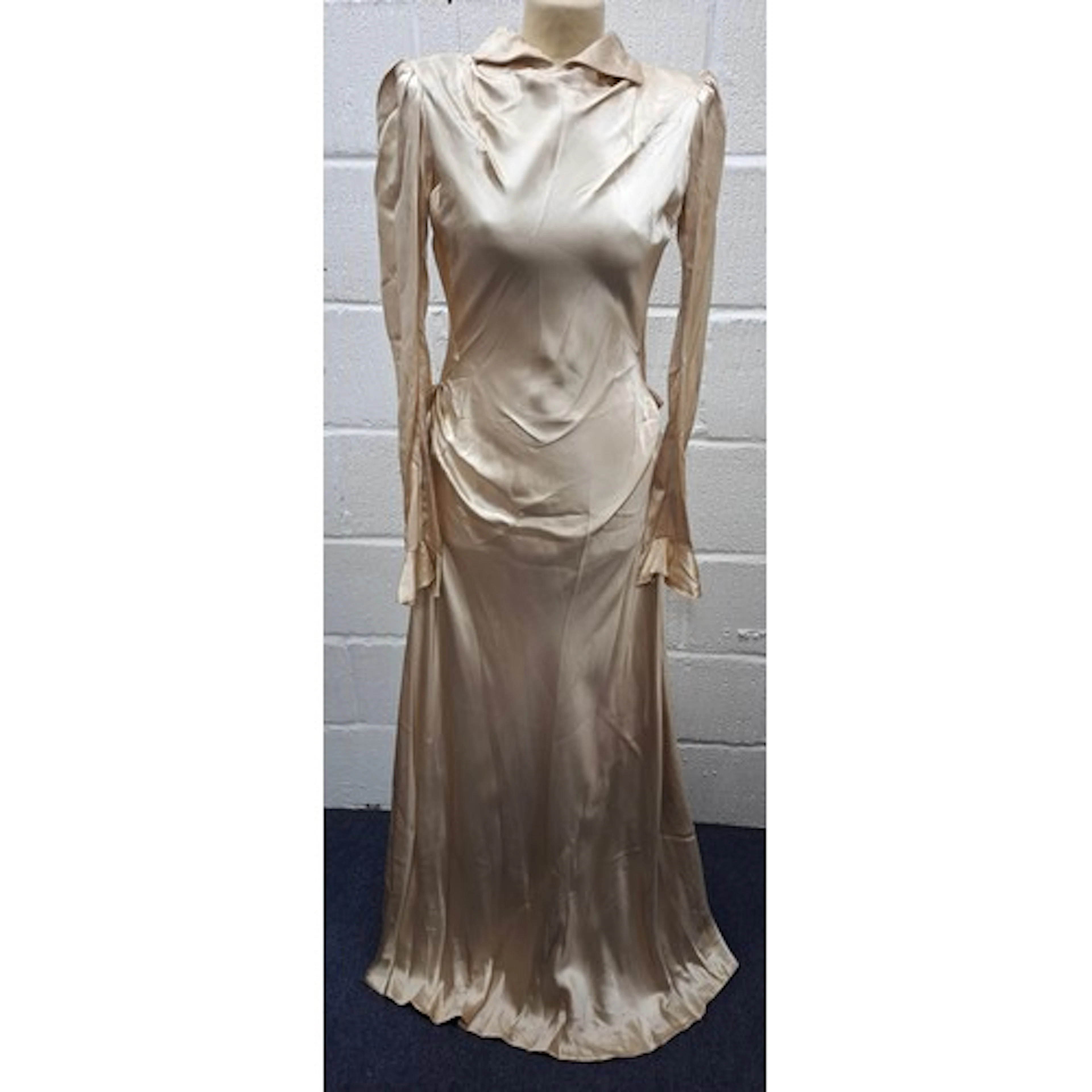 A 1937 cream wedding dress approx 36" chest together with a ...