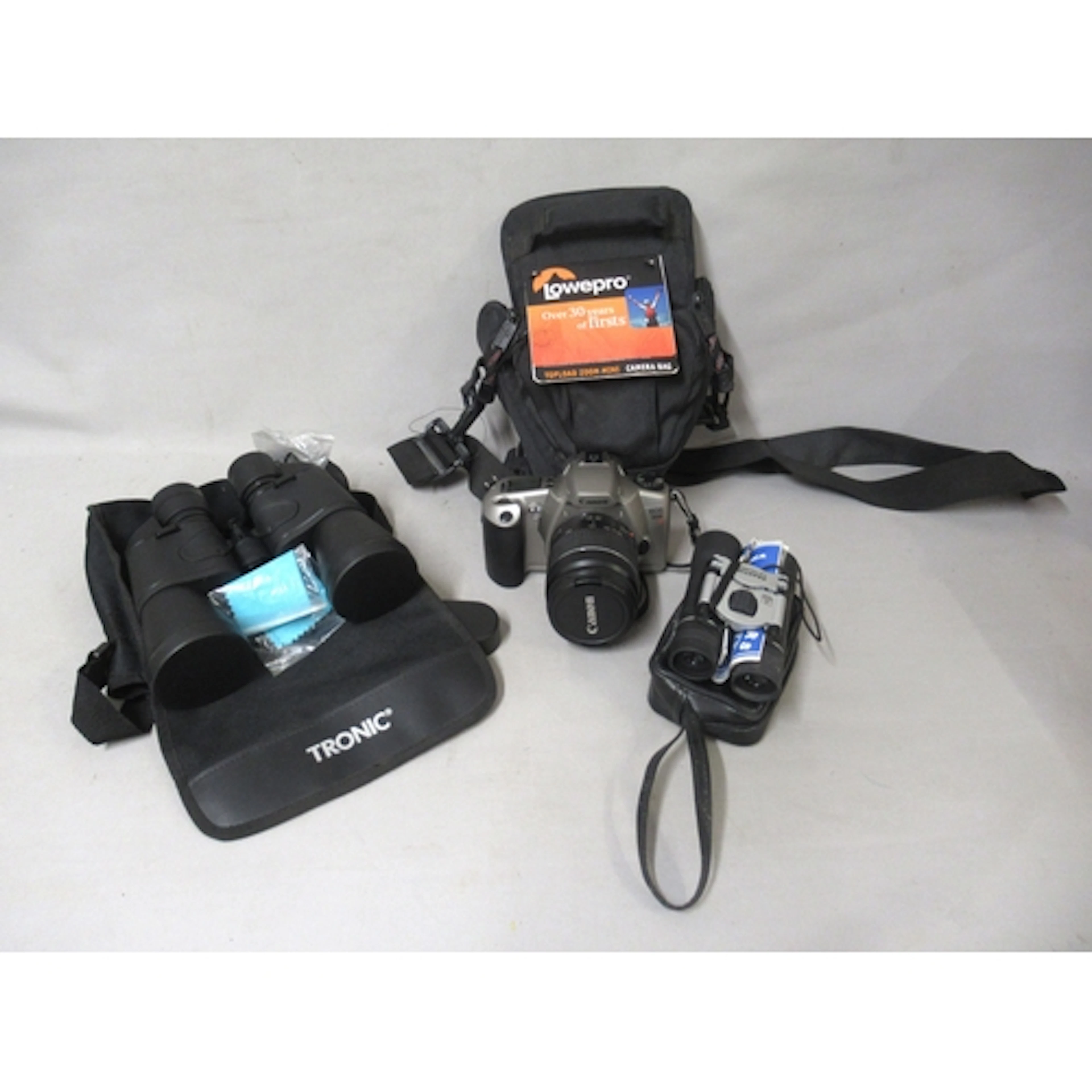 Canon EOS 3000 camera, together with two pairs of binoculars