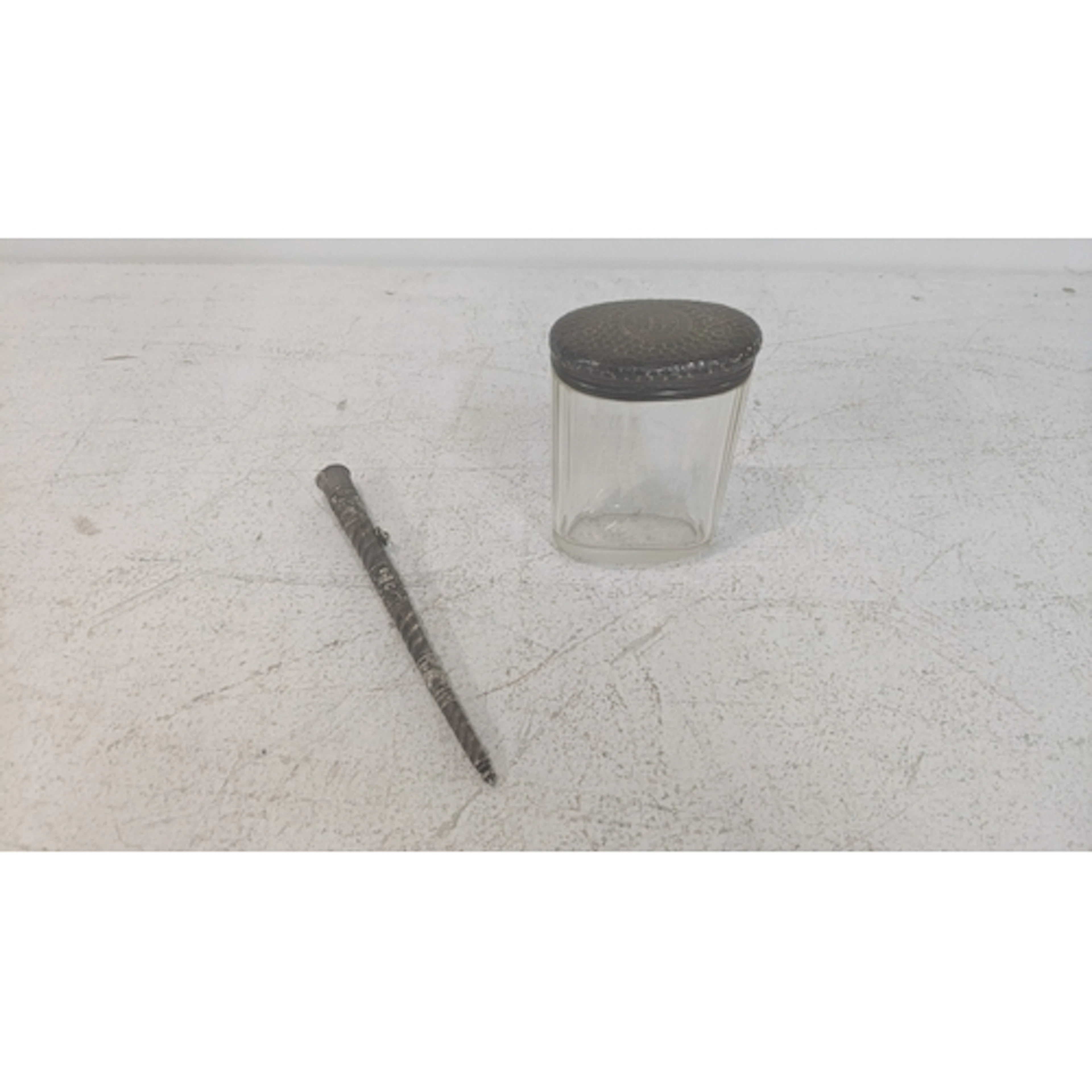 A silver lidded and glass dressing table jar and a silver co...