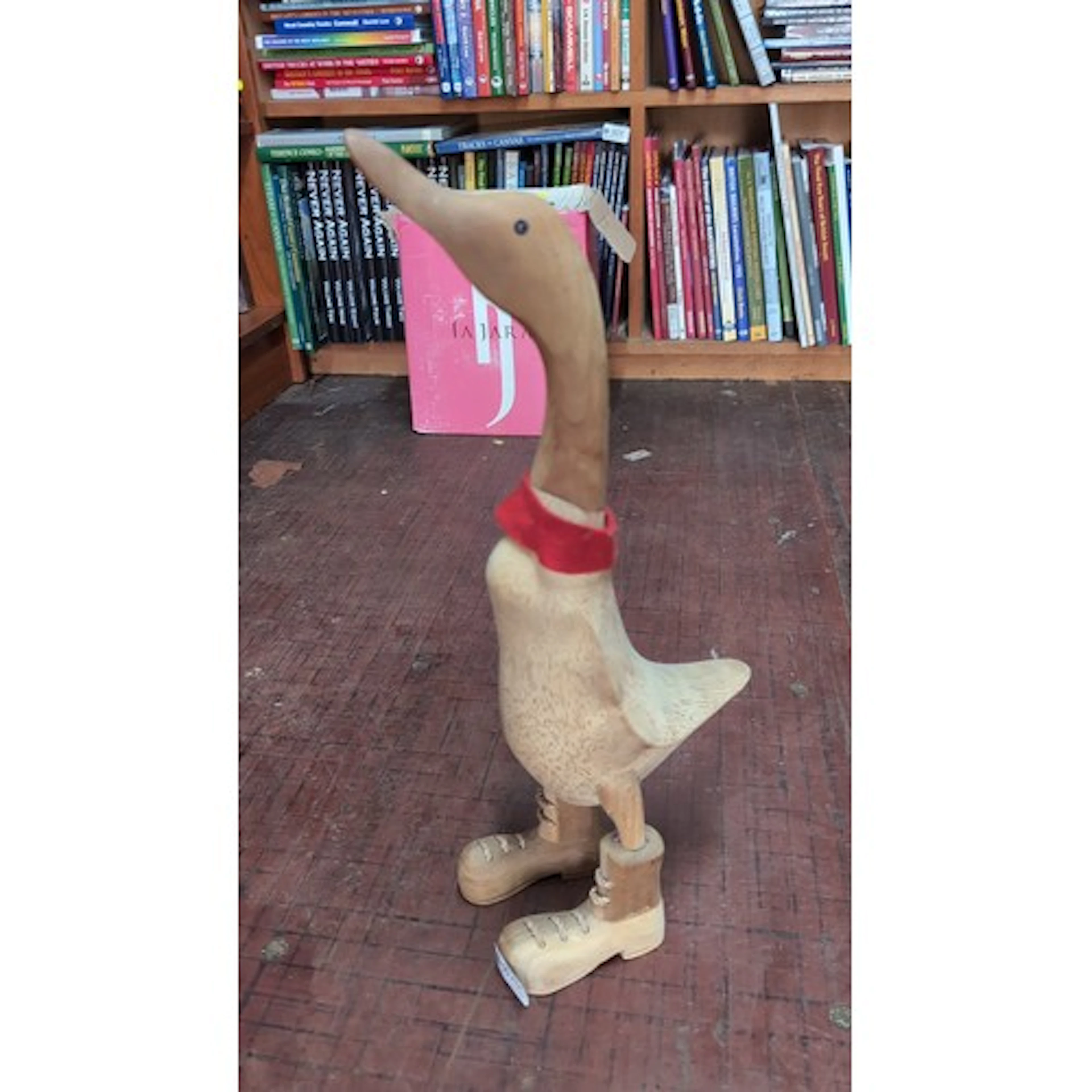 Carved wood figure of a standing goose, the head stained dar...