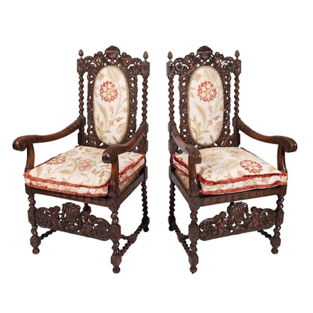 A pair of carved beechwood open armchairs in the Charles II ...