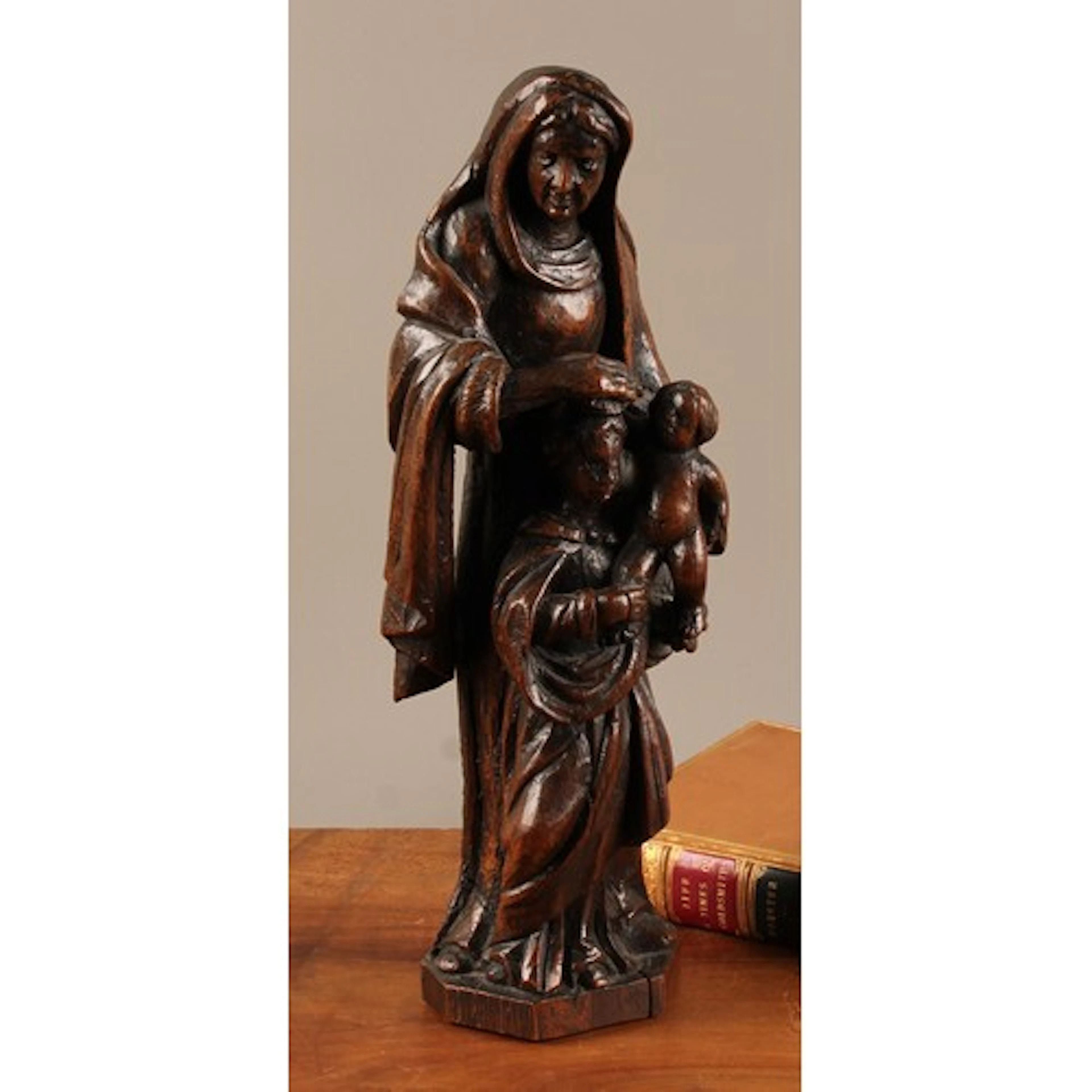 A 19th century oak carving, Madonna and Child with Saint Ann...