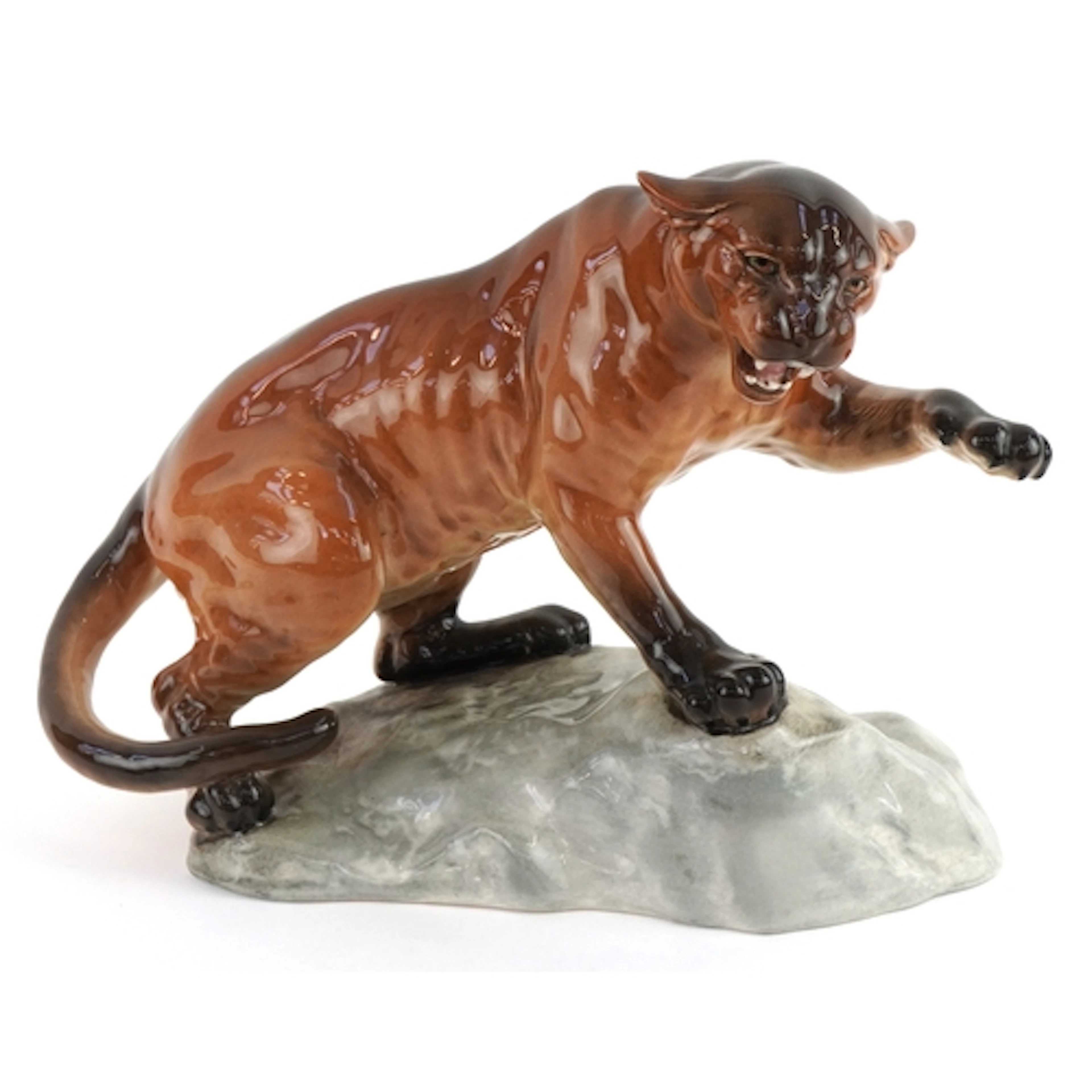 Beswick porcelain figure of a puma numbered 1702, 31cm wide.