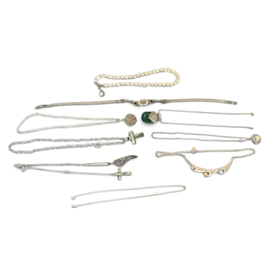 A GROUP OF SILVER NECKLACES TO INCLUDE STONE SET, PEARLS Gro...