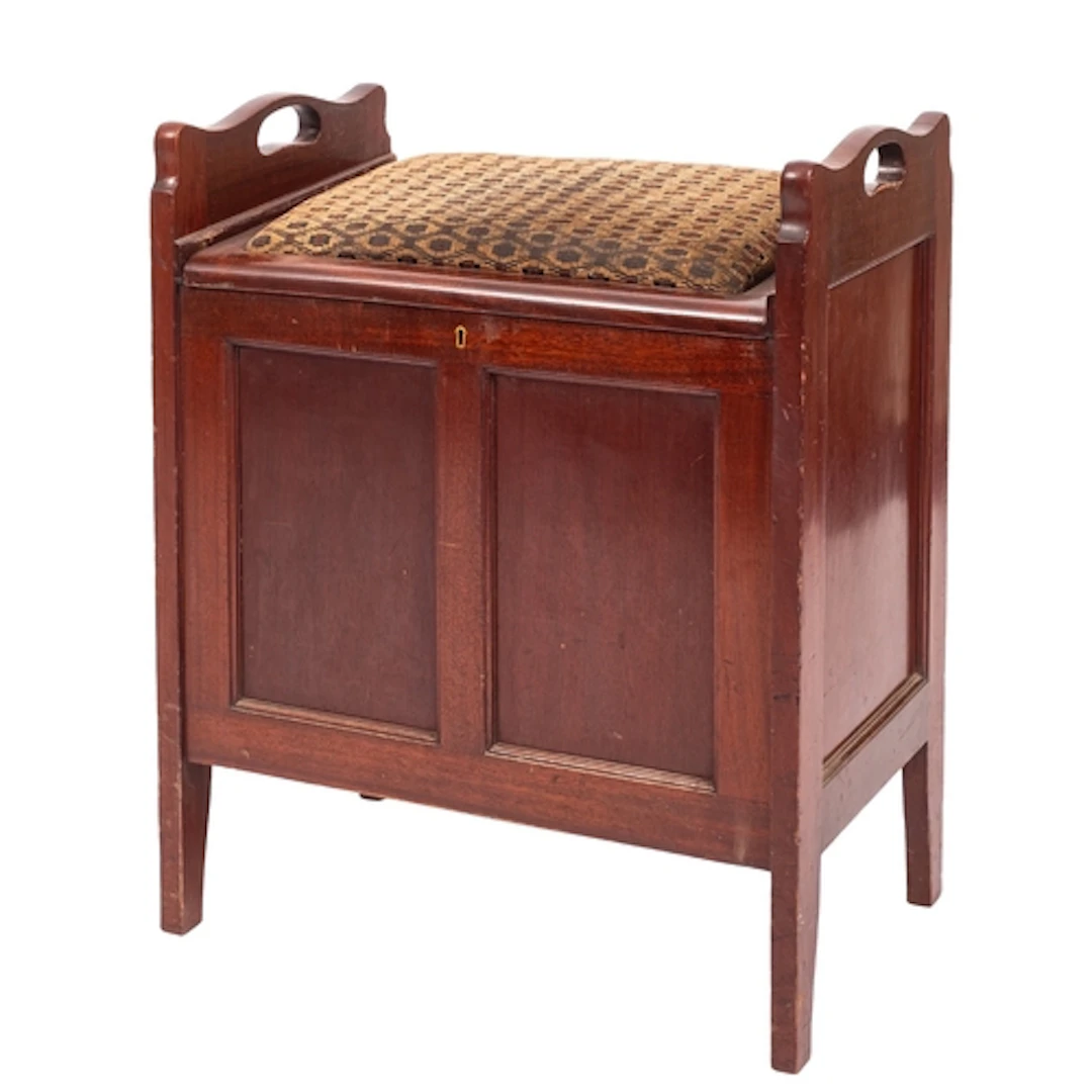 An Edwardian mahogany and upholstered organ stool, early 20t...