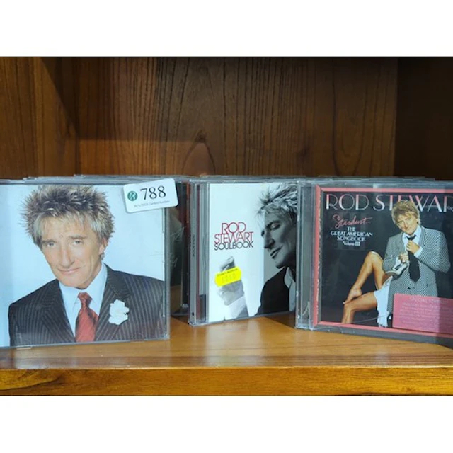 A collection of Rod Stewart compact discs, including Soulboo...