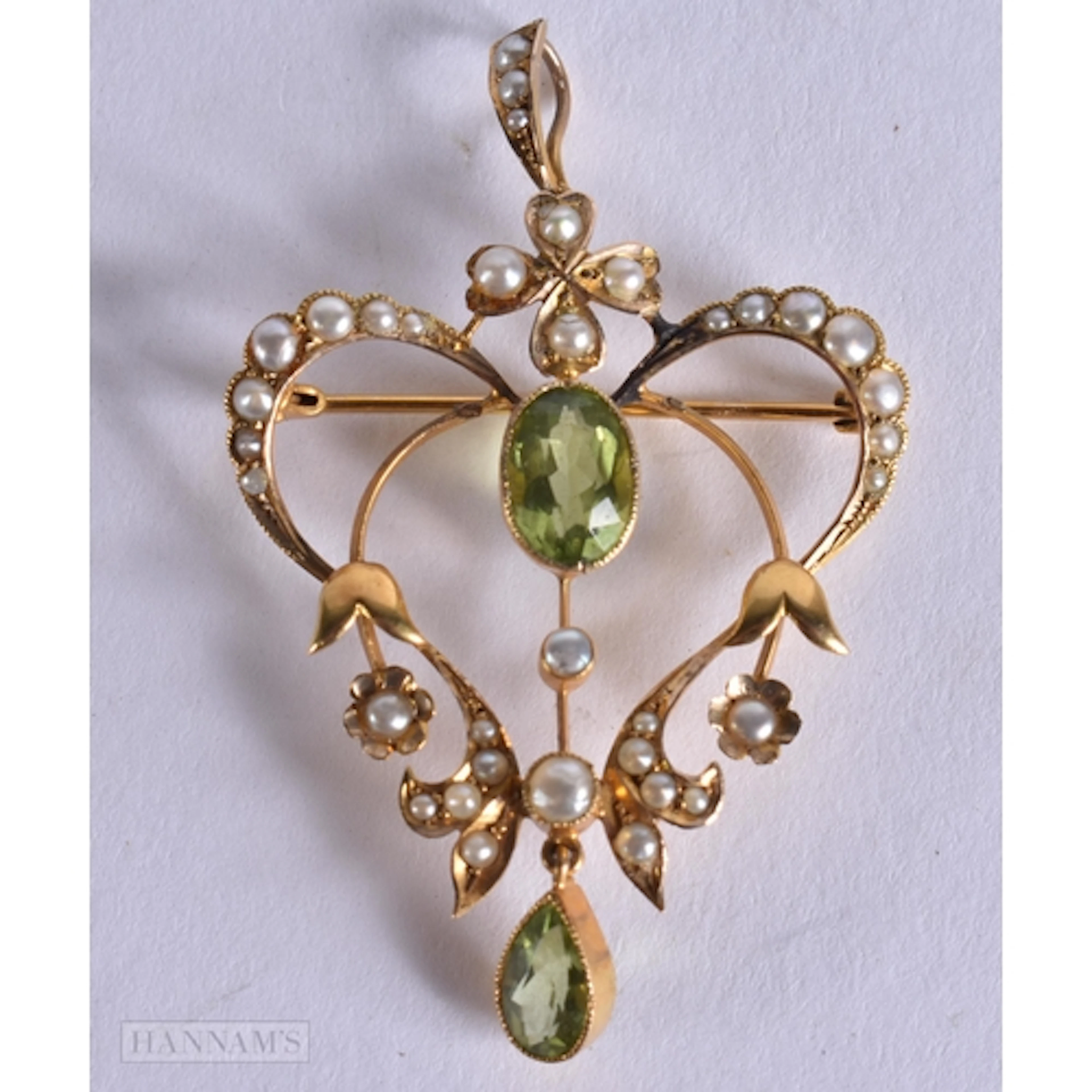A VICTORIAN 15CT GOLD AND PERIDOT PEARL PENDANT. 4.4 grams. ...