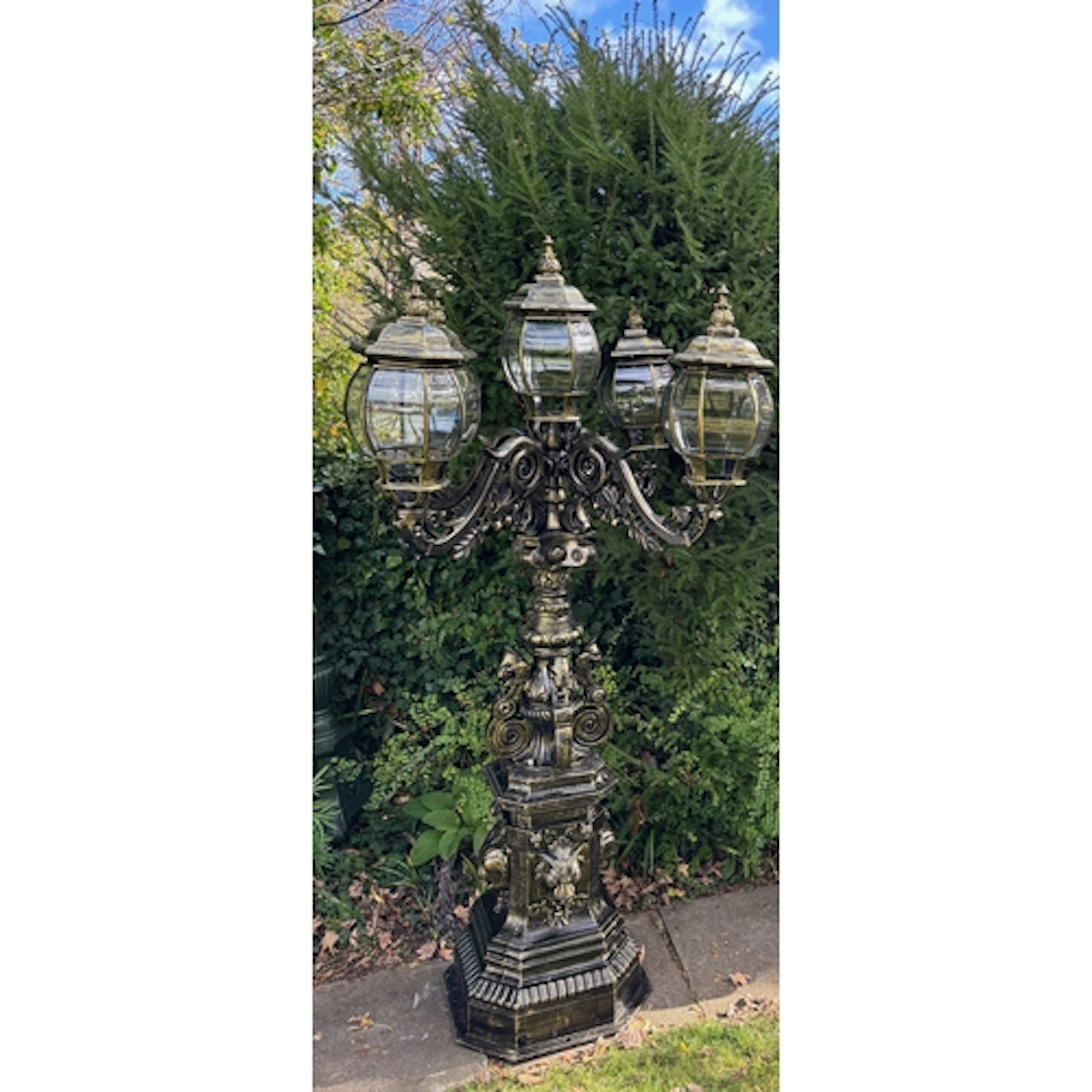 A magnificent and imposing classical cast iron five-light ca...