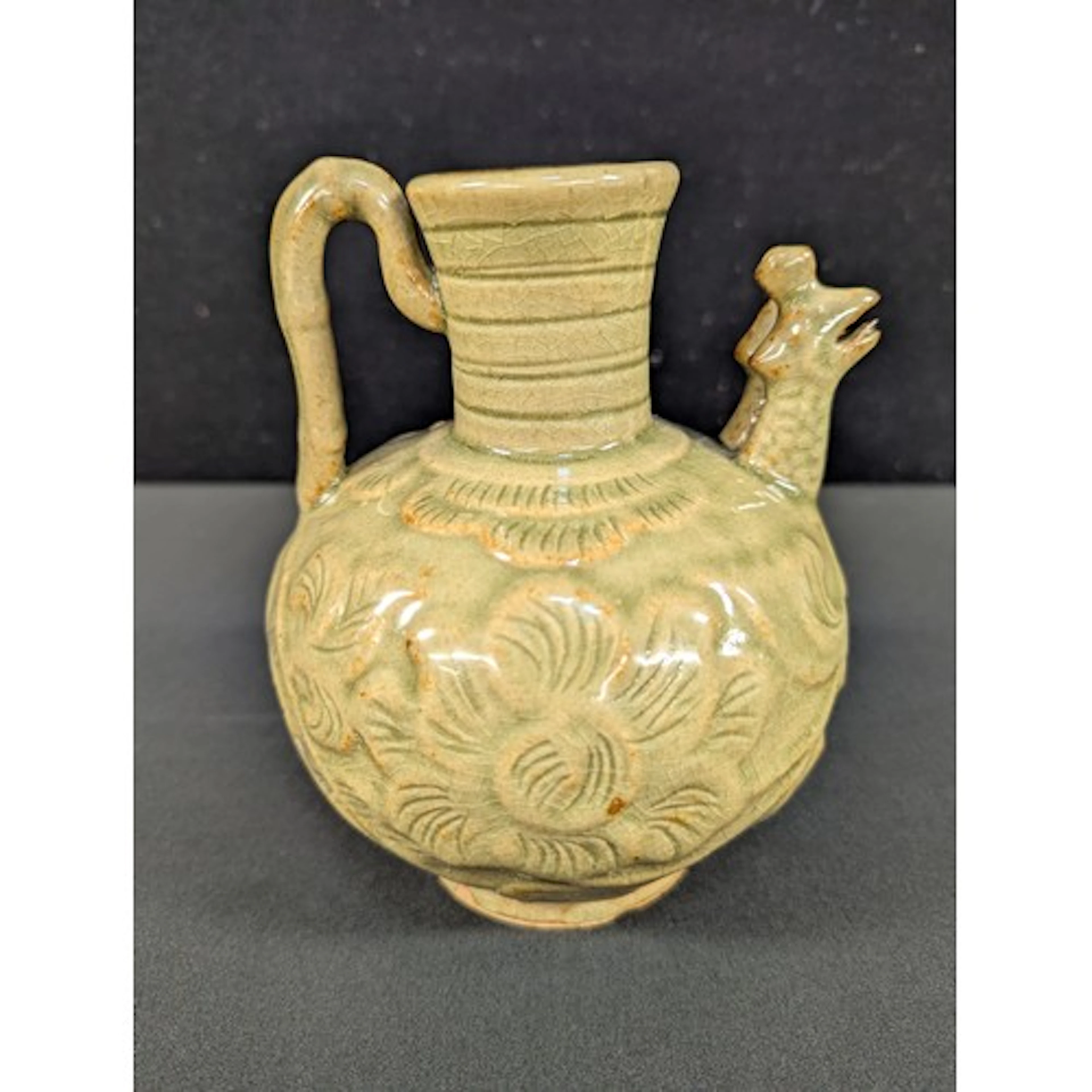 A Chinese Song Dynasty type celadon wine pot, double bird ma...