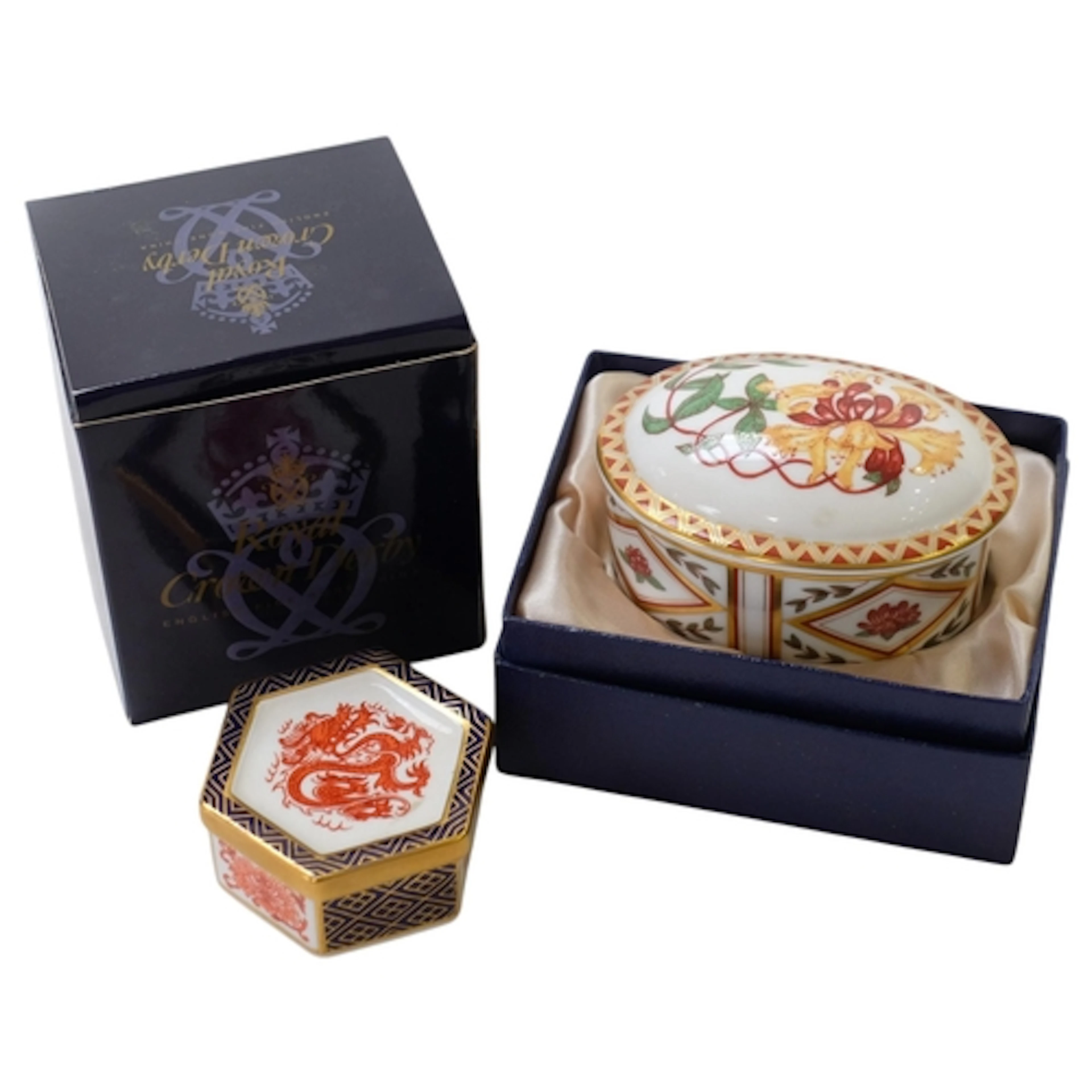 2 boxed Royal Crown Derby pillboxes, including examples A129...
