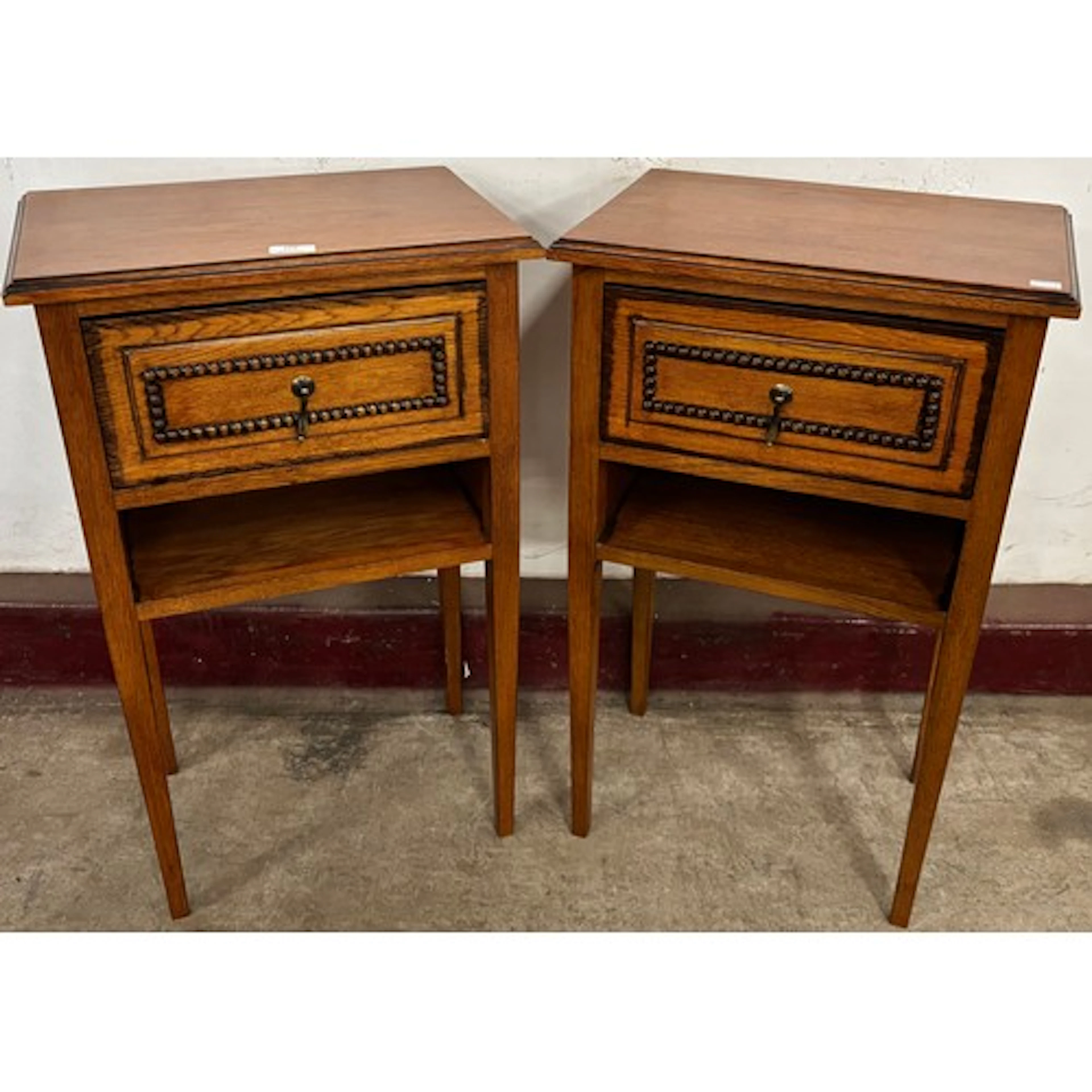 A pair of Arts & Crafts style oak bedside tables